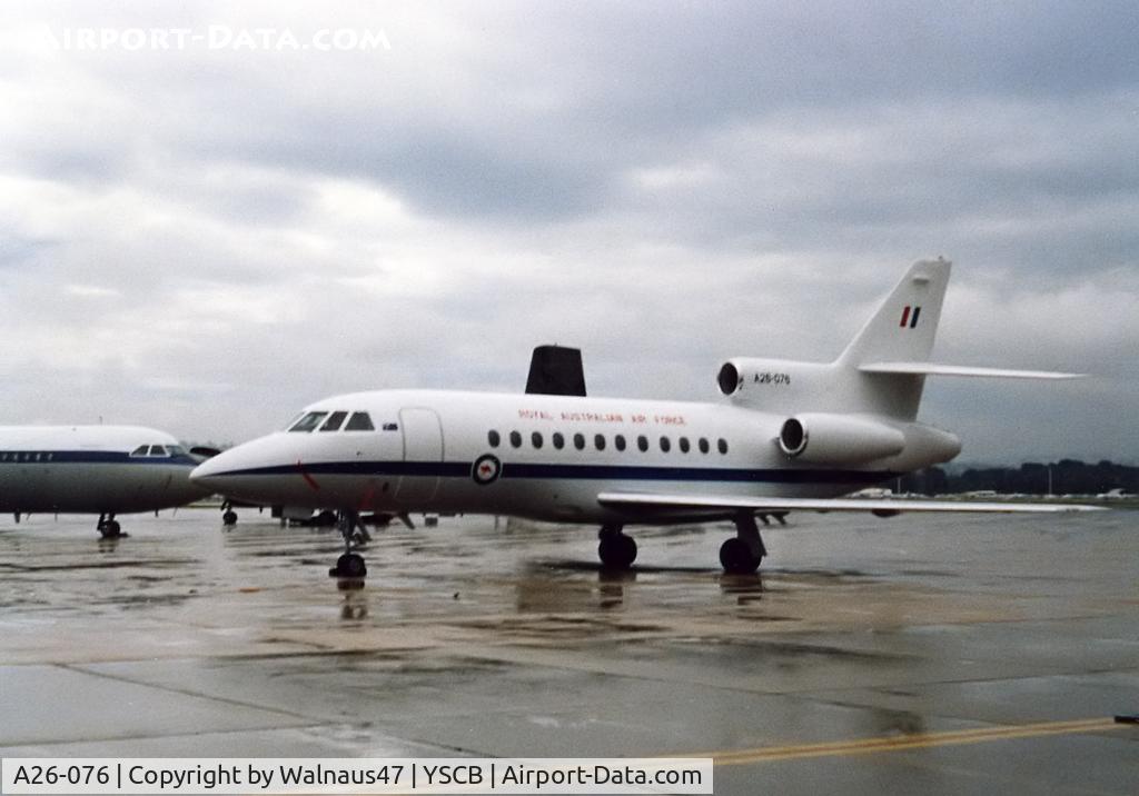 A26-076, 1989 Dassault Falcon 900 C/N 076, Low res view of RAAF 34 Squadron Falcon 900 A26-076 Cn 076 at her RAAF Fairbairn YSCB 'home-base' on a wet day in 1989. (A Caribou and an 34 Sqn VIP BAC-111-217EA are at rear [either A12-124 or A12-125]).
