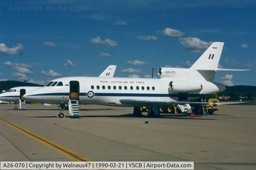 A26-070, 1989 Dassault Falcon 900 C/N 070, Port side view of RAAF 34 Squadron Falcon 900 A26-070 Cn 070 (and 'Sister-Ship' A26-076 at rear) at her RAAF Fairbairn 'home-base' in 1990. The five F900s were replaced by two Boeing B737 BBJs, and three Challengers in 2002.