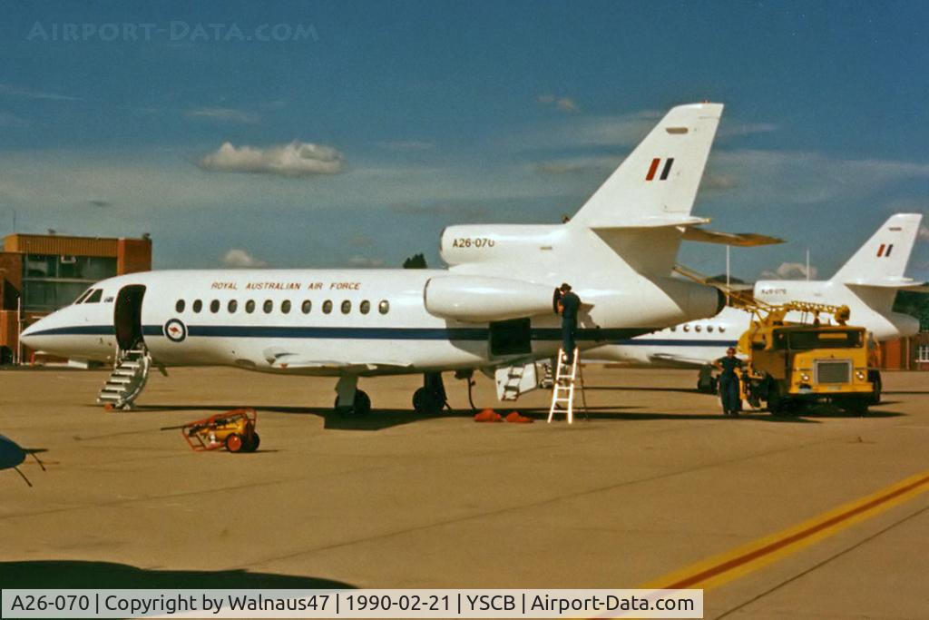 A26-070, 1989 Dassault Falcon 900 C/N 070, Rear Port side view of RAAF 34 Squadron Falcon 900 A26-070 Cn 070 (and 'Sister-Ship' A26-076 at rear) being refuelled at her RAAF Fairbairn 'home-base' in 1990. The five F900s were replaced by two Boeing B737 BBJs, and three Challengers in 2002.