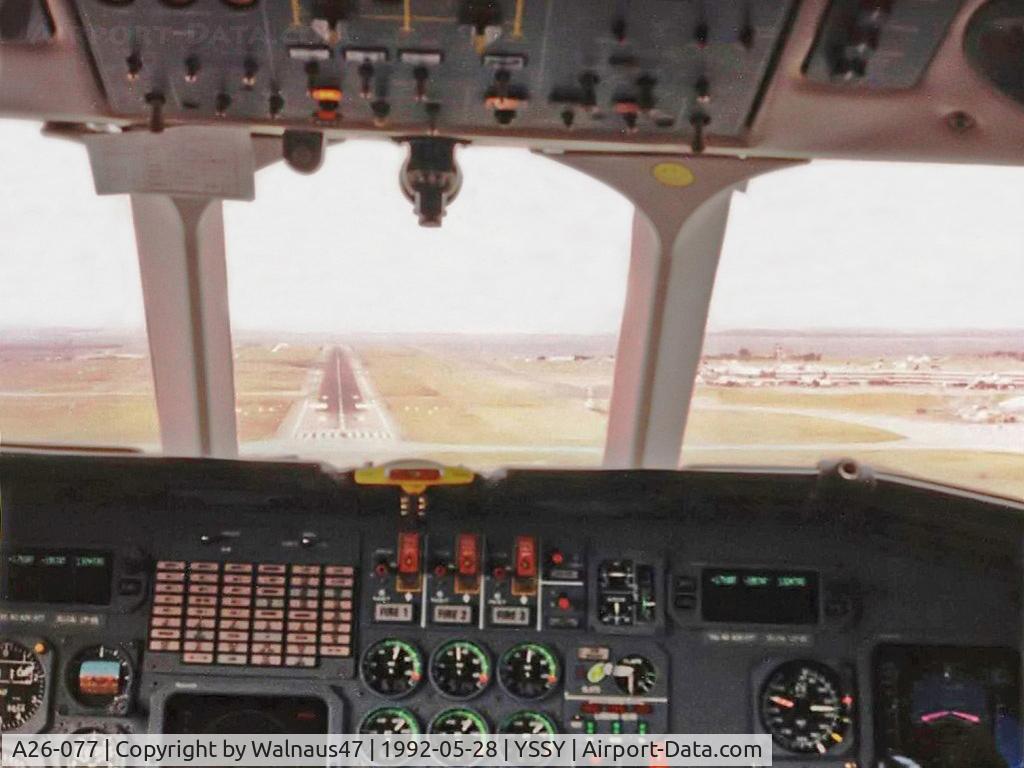 A26-077, 1989 Dassault Falcon 900B C/N 077, Low Res Flight Deck view of RAAF 34 Squadron VIP Falcon 900 A26-077 Cn 077 during final approach to Sydney YSSY Rwy 16R, at the end of a 0.4 hour flight from Canberra YSCB on 28May1992. Runway visible in centre windscreen panel.