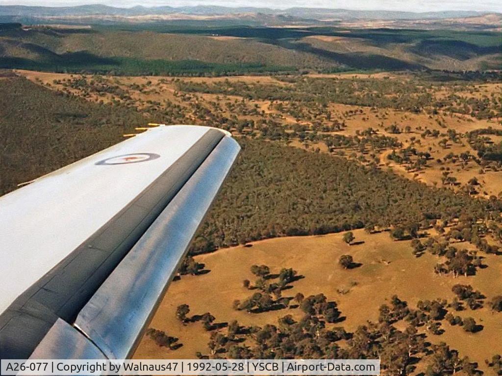 A26-077, 1989 Dassault Falcon 900B C/N 077, Wing View taken from 34 Squadron VIP Falcon 900 A26-077 Cn 77  on approach to Canberra's Rwy 30, at the end of a 0.4 hour flight from Sydney on 28May1992. This photo was taken approaching 34 Squadron's home base - RAAF Base Fairbairn YSCB.