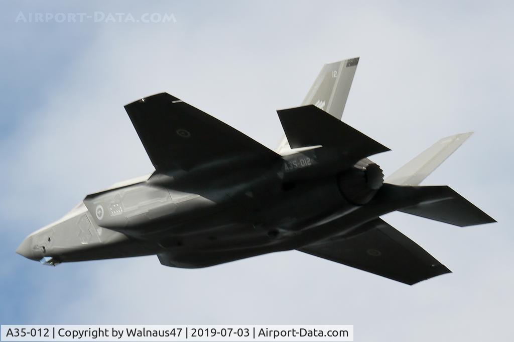 A35-012, 2019 Lockheed-Martin F-35A Lightning II C/N AU-12, Rear Port view of RAAF Lockheed Martin F-35A Lightning II A35-012 Cn AU-12, shown flying over Russell Offices Canberra ACT on the morning of 03Jul2019. The Flypast was for the Chief of Air Force ‘Change of Command’ Ceremony. (Low Res).