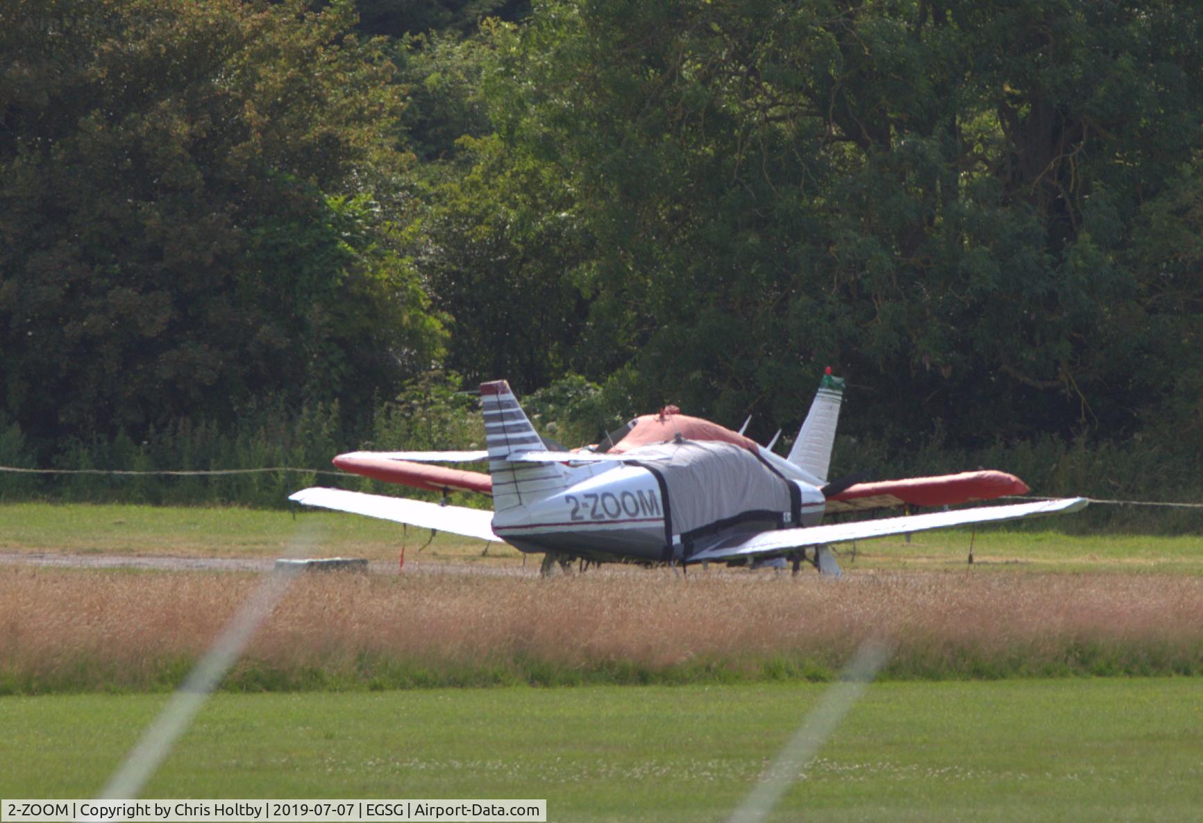 2-ZOOM, 1995 Rockwell Commander 114B C/N 14635, Parked and covered at Stapleford Tawney, Essex