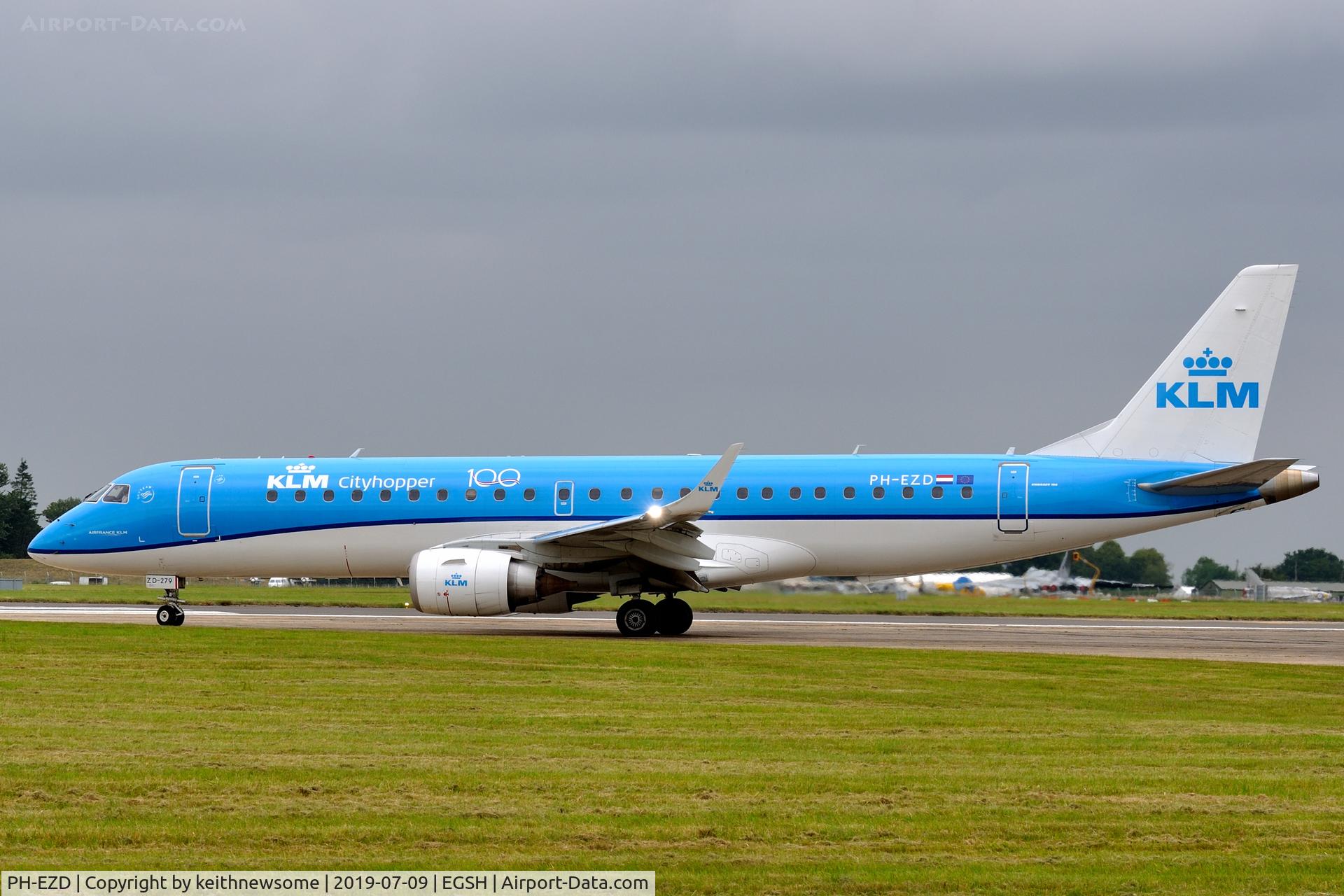 PH-EZD, 2009 Embraer 190LR (ERJ-190-100LR) C/N 19000279, Leaving Norwich with '100 years' logo.
