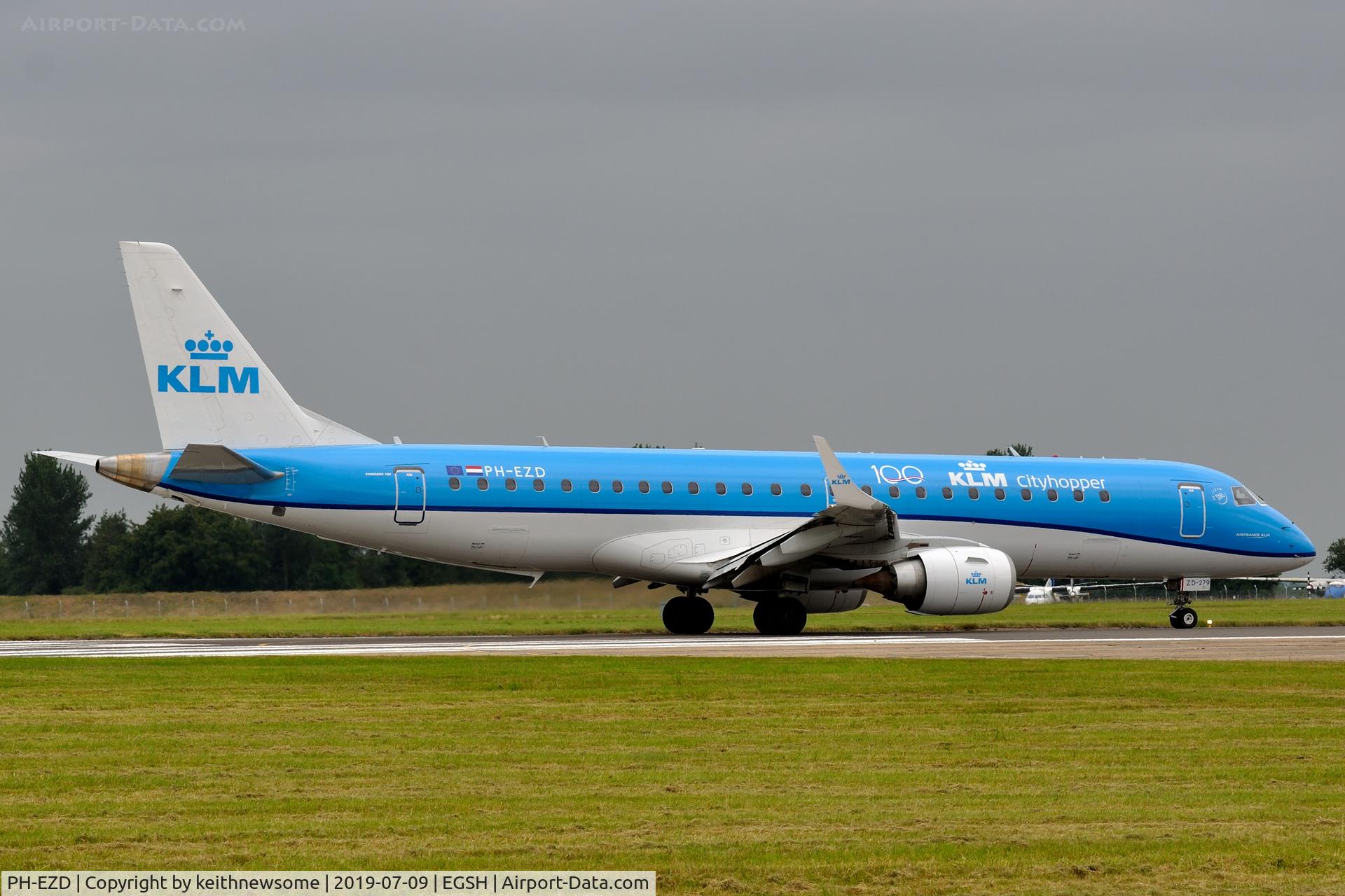 PH-EZD, 2009 Embraer 190LR (ERJ-190-100LR) C/N 19000279, Leaving Norwich with '100 years' logo.
