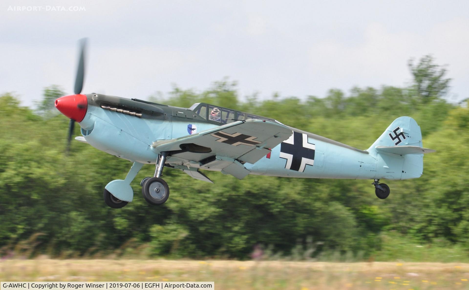 G-AWHC, 1954 Hispano HA-1112 M4L C/N 40/2, Two seat Buchon coded Red 11 departing Runway 22.