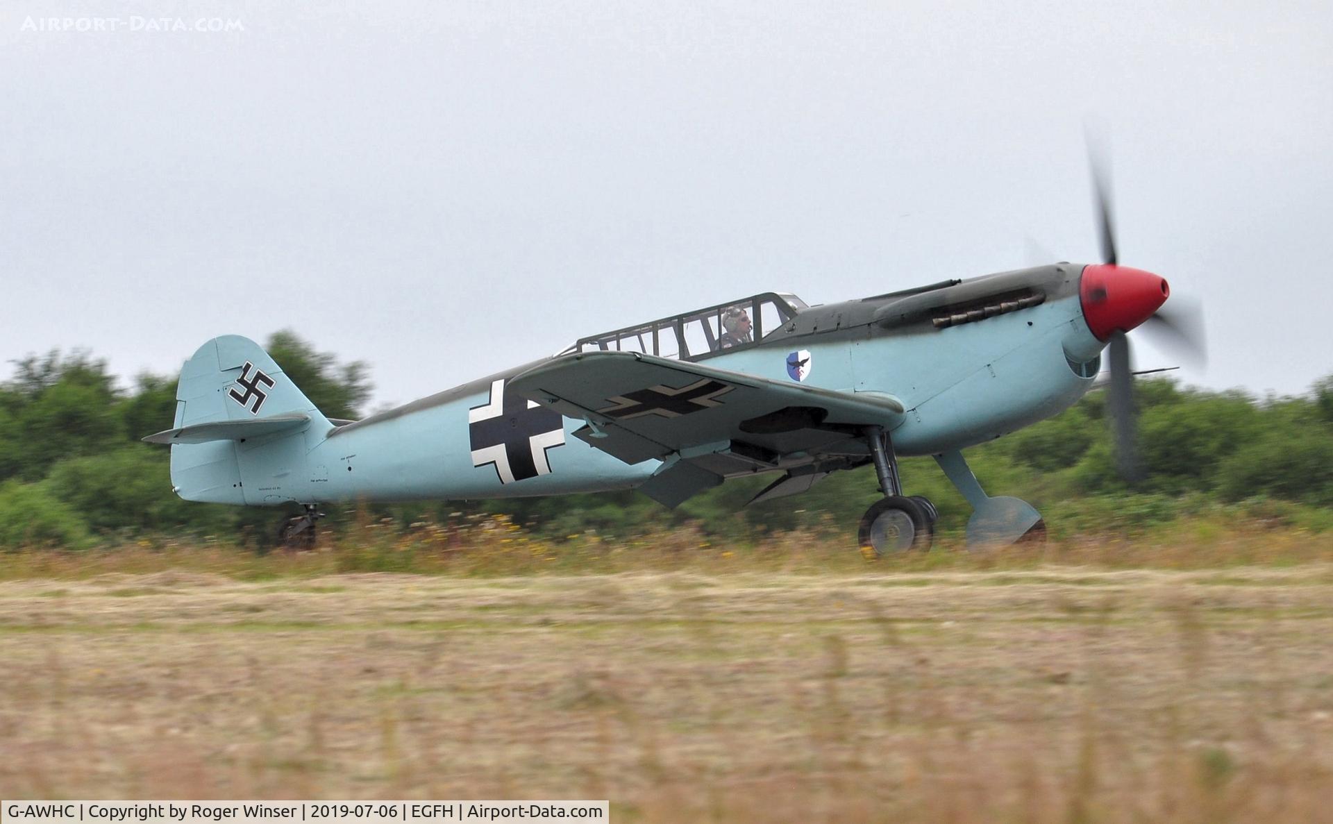 G-AWHC, 1954 Hispano HA-1112 M4L C/N 40/2, Two seat Buchon coded Red 11 departing Runway 04.