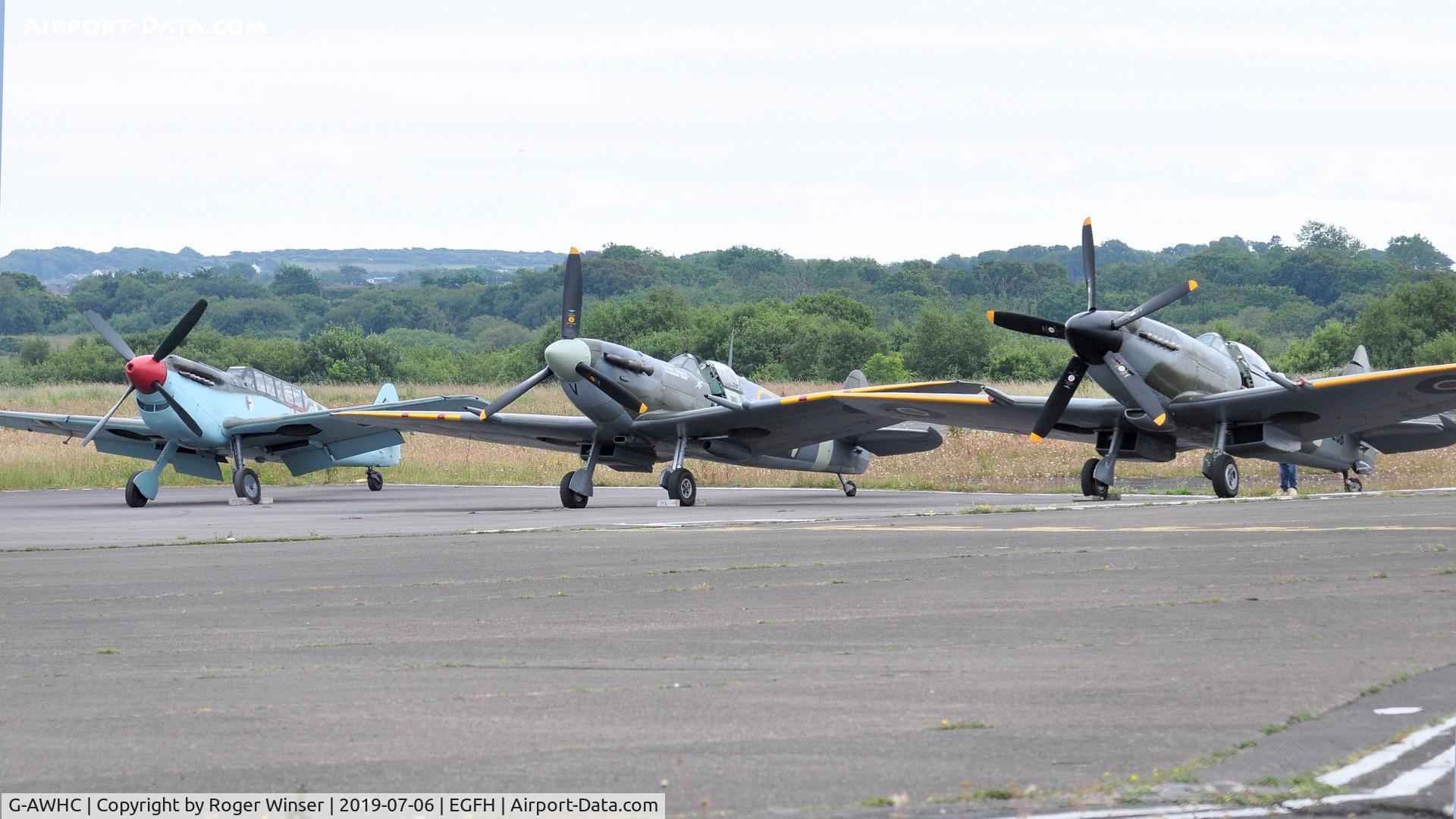 G-AWHC, 1954 Hispano HA-1112 M4L C/N 40/2, Two seat Buchon coded Red 11 with two Spitfires, G-IBSY and G-SPIT.