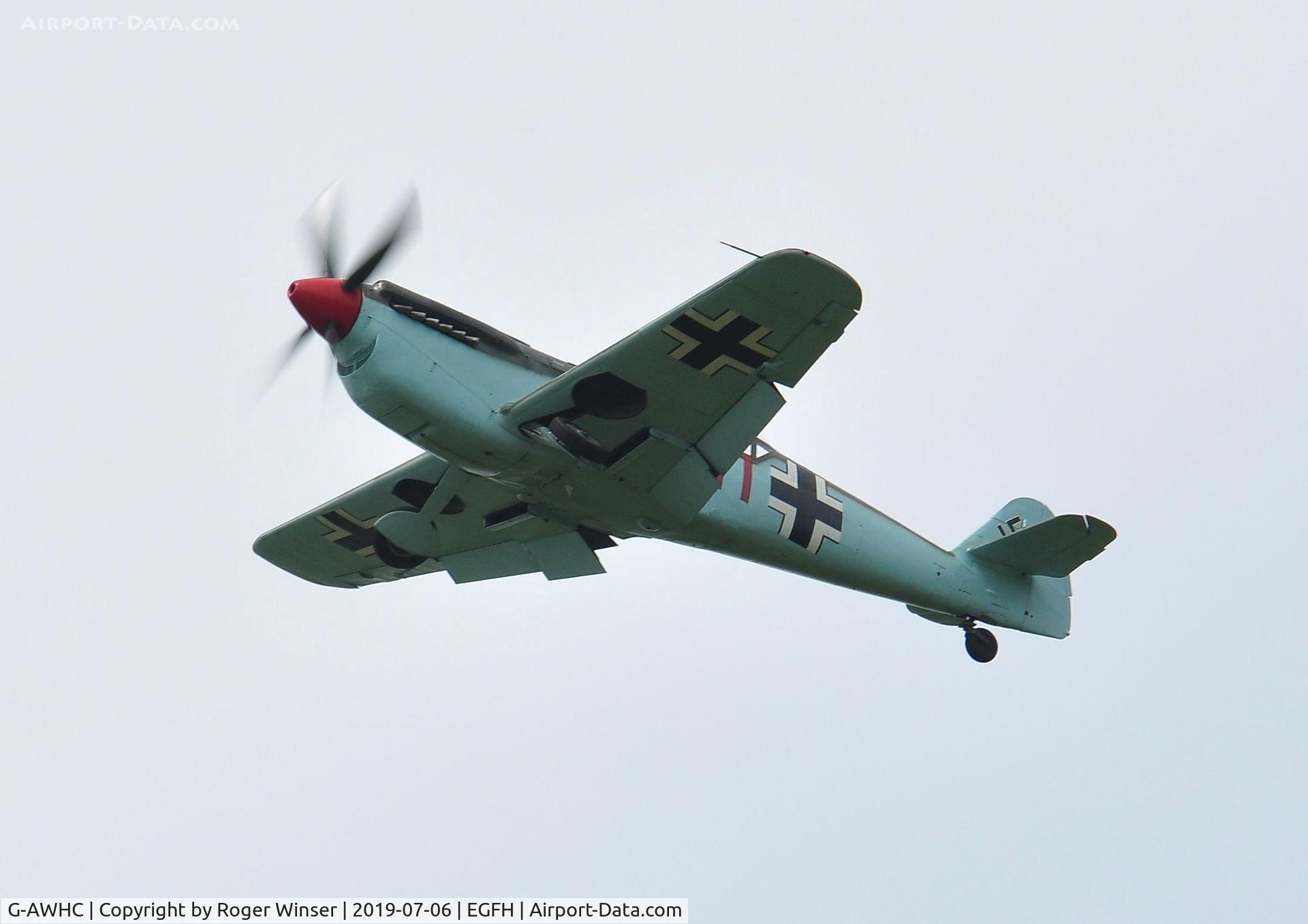 G-AWHC, 1954 Hispano HA-1112 M4L C/N 40/2, Two seat Buchon coded Red 11 in the overhead.