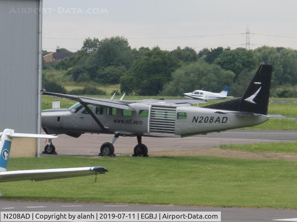 N208AD, 1992 Cessna 208B Grand Caravan C/N 208B0327, At Gloucestershire Airport (Staverton), partially obscured