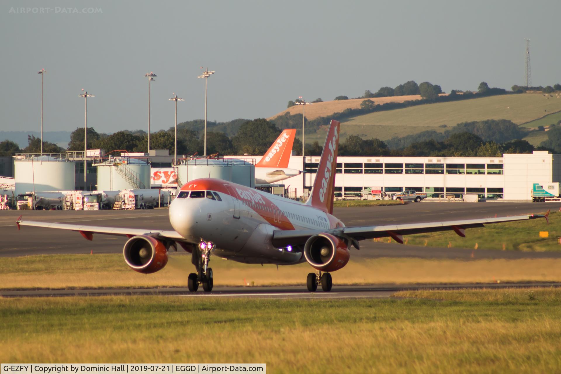 G-EZFY, 2010 Airbus A319-111 C/N 4418, Sunset departure from RWY 27