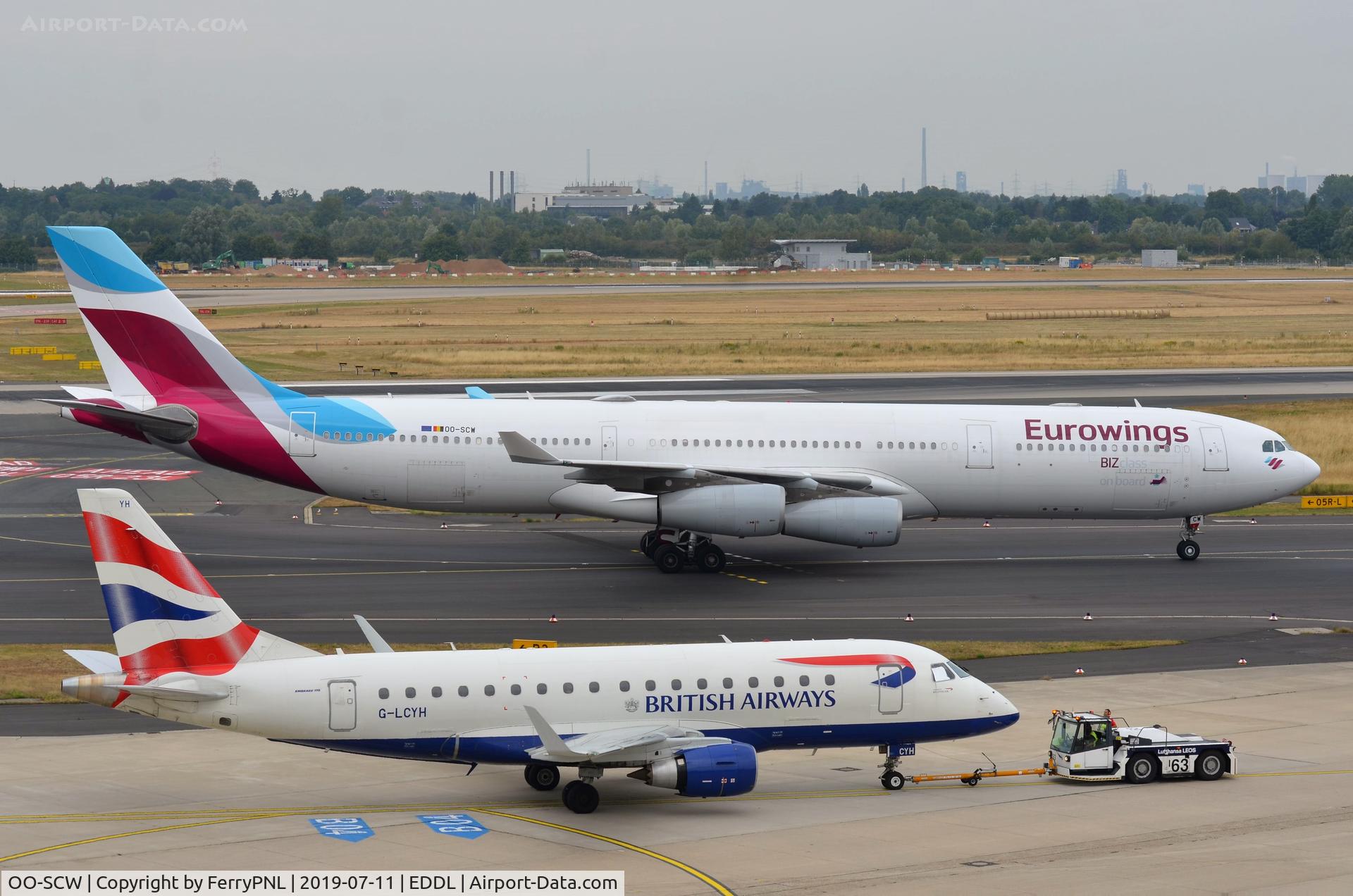 OO-SCW, 2000 Airbus A340-313 C/N 335, Eurowings A343 taxying in while BA ERJ170 being pushed-back.