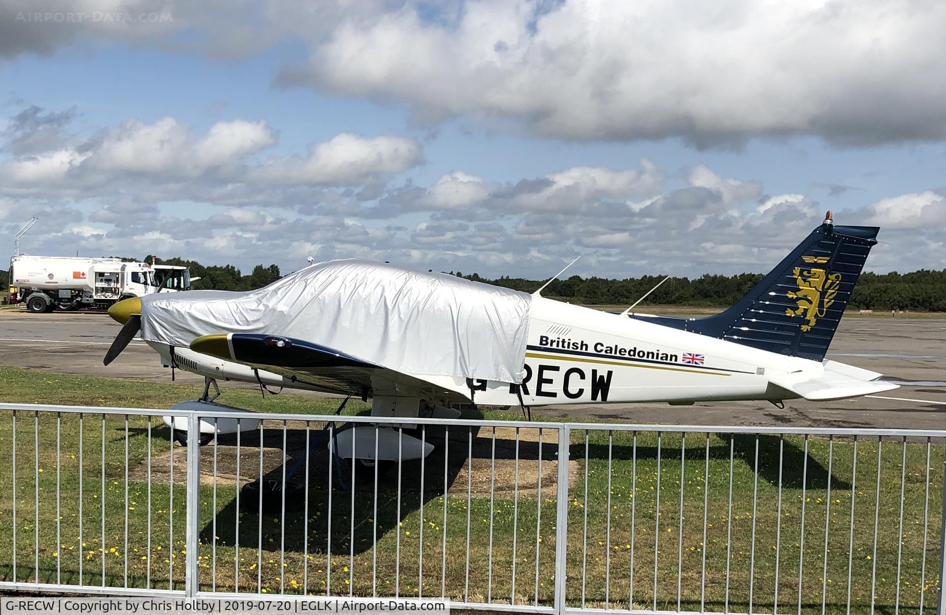 G-RECW, 1980 Piper PA-28-181 Cherokee Archer II C/N 288090257, Parked and covered at Blackbushe