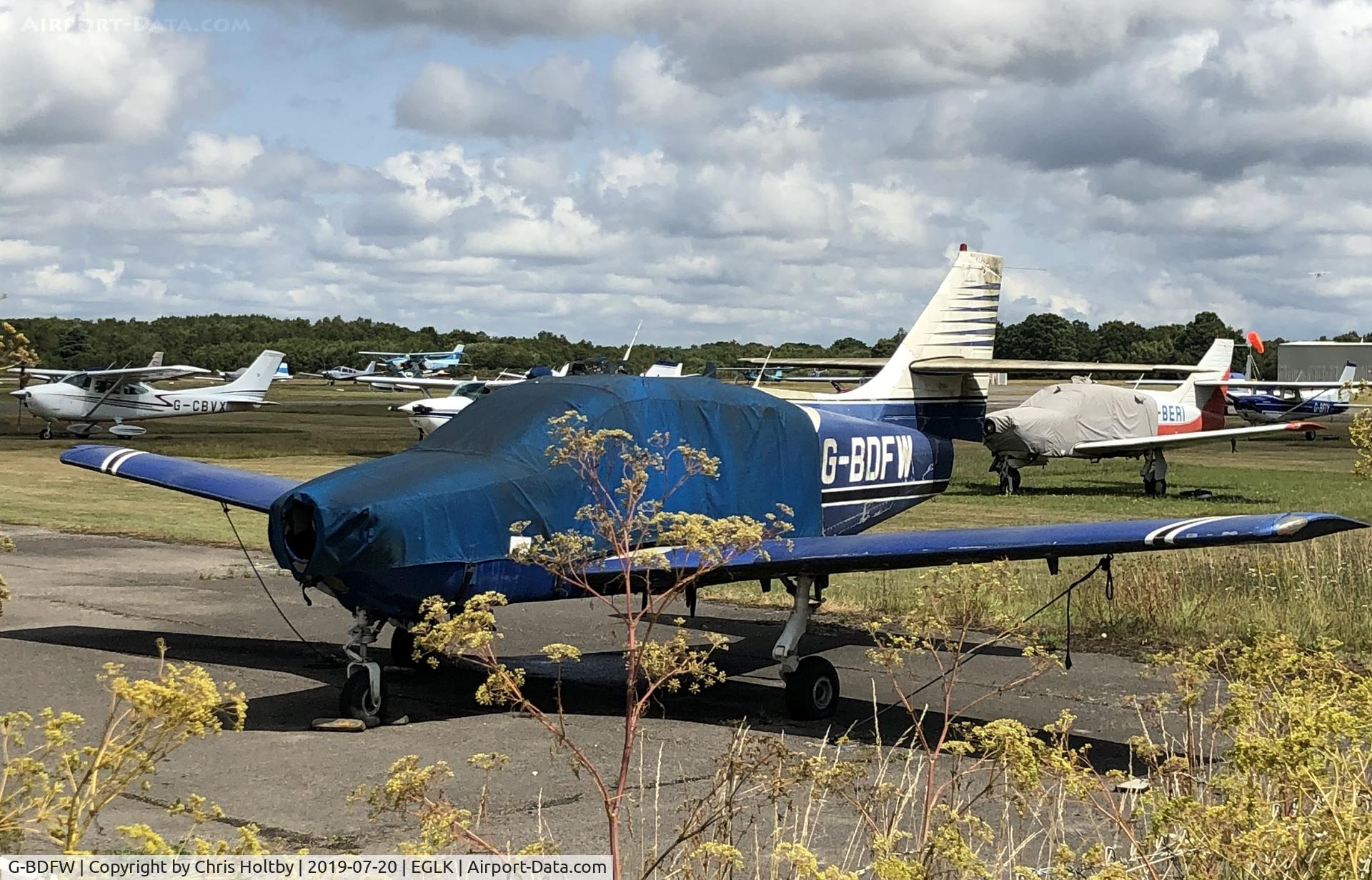 G-BDFW, 1975 Rockwell International 112 Commander C/N 308, Covered and stored outside at Blackbushe but not weathering too well and deteriorating.