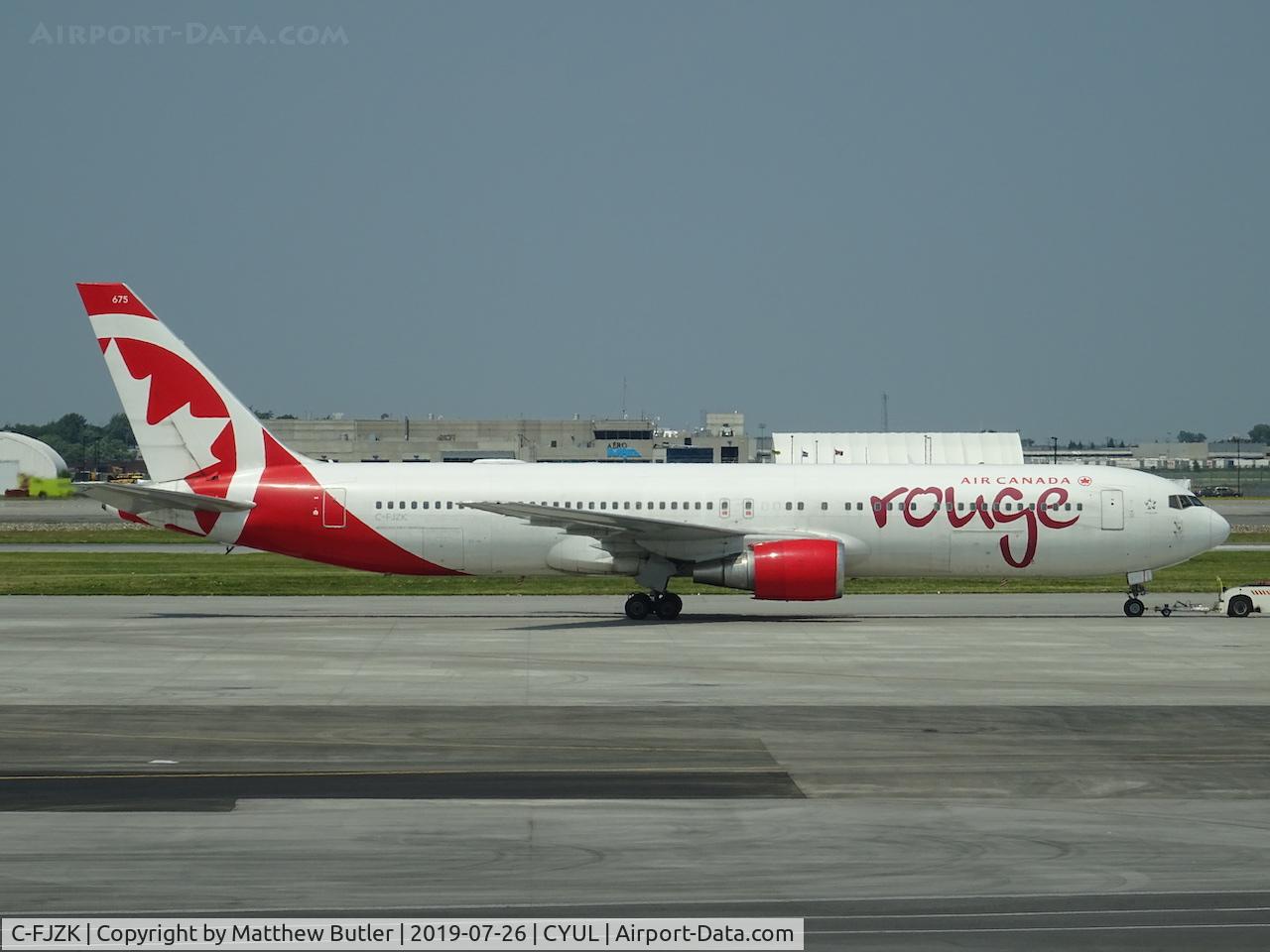 C-FJZK, 2001 Boeing 767-33A/ER C/N 29386, Being towed at YUL