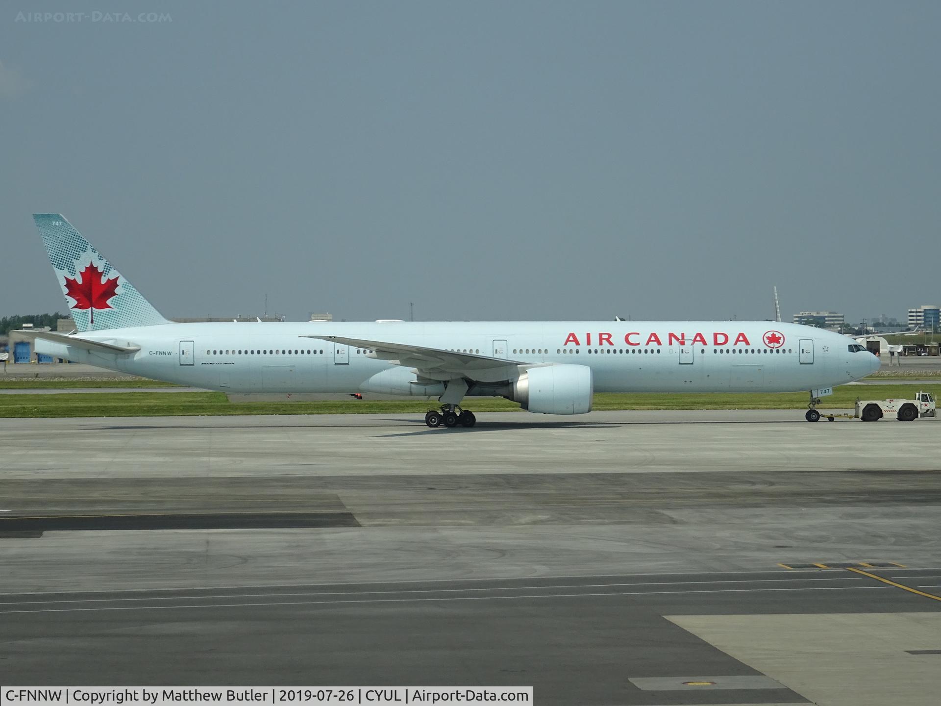C-FNNW, 2014 Boeing 777-333/ER C/N 43250, Being towed at CYUL