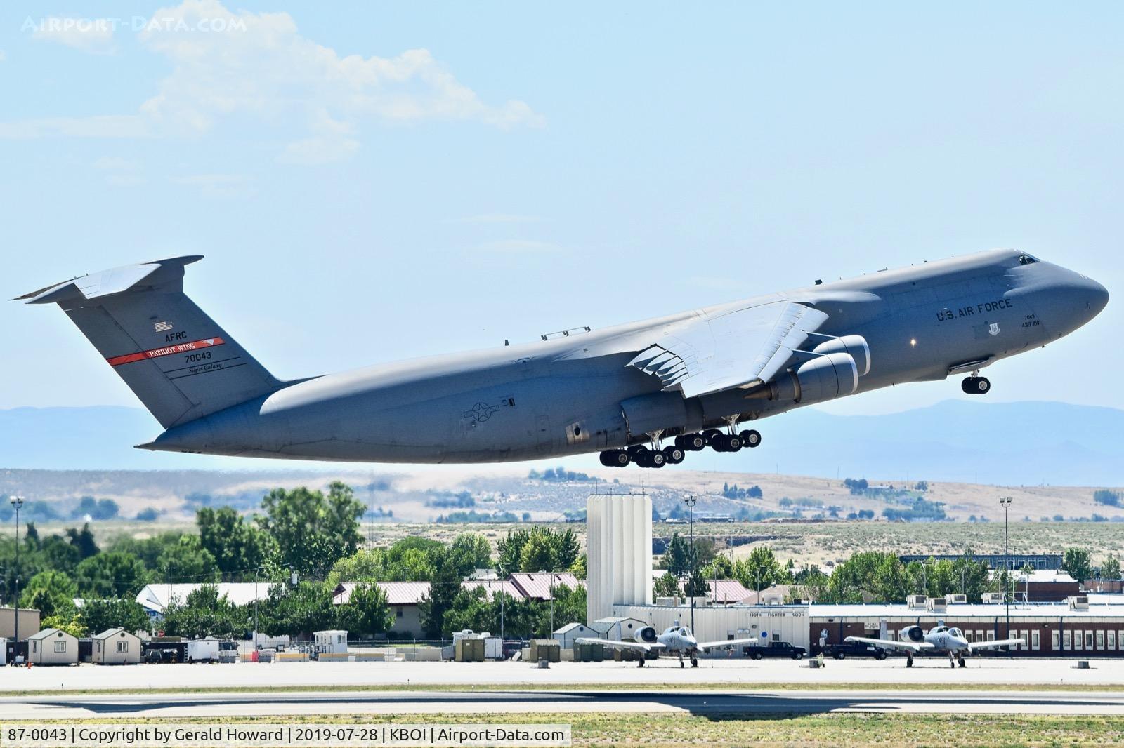 87-0043, 1988 Lockheed C-5M Super Galaxy C/N 500-129, Climb out from RWY 28L. 439th Airlift Wing 