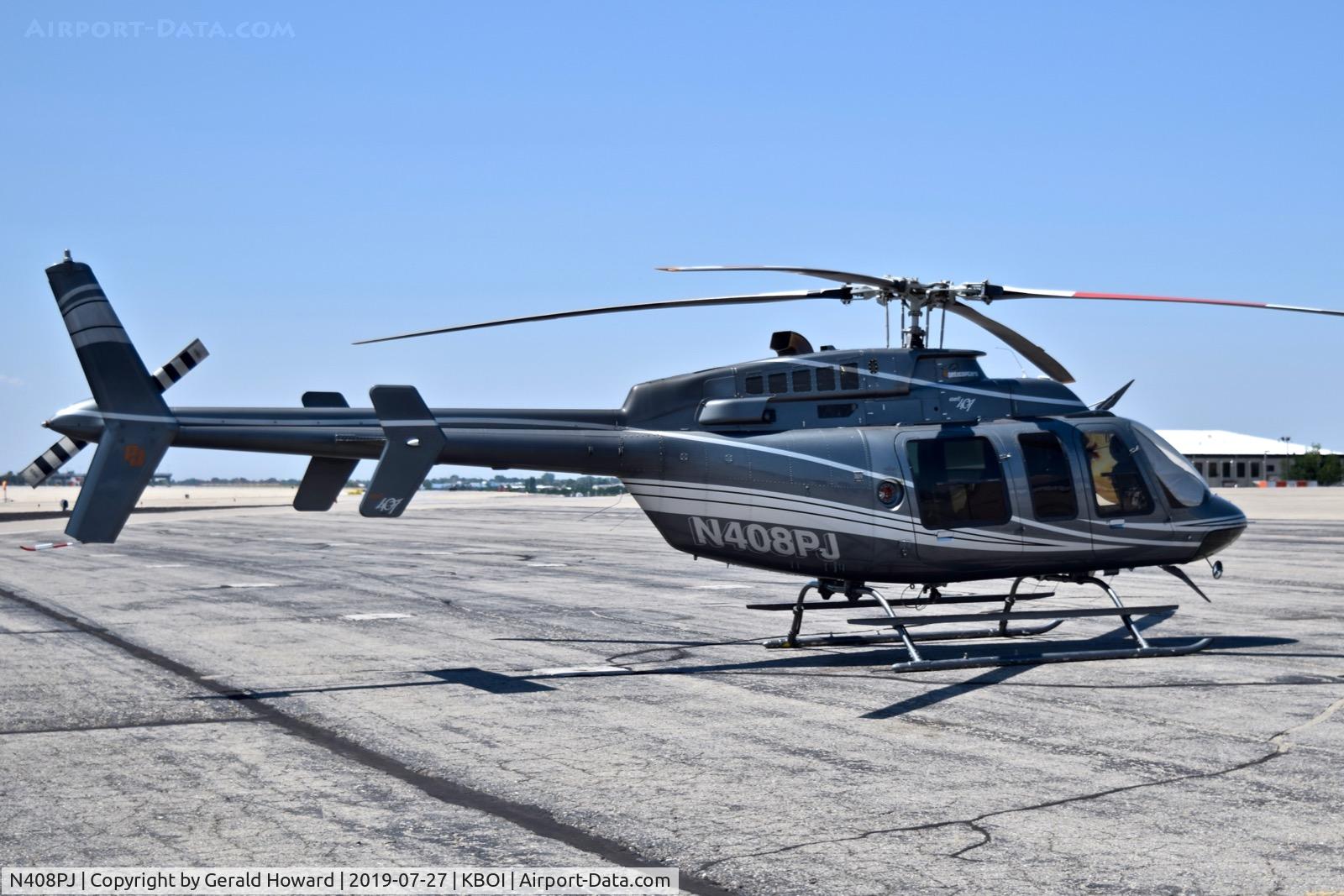 N408PJ, 1998 Bell 407 C/N 53286, Parked on the north GA ramp.