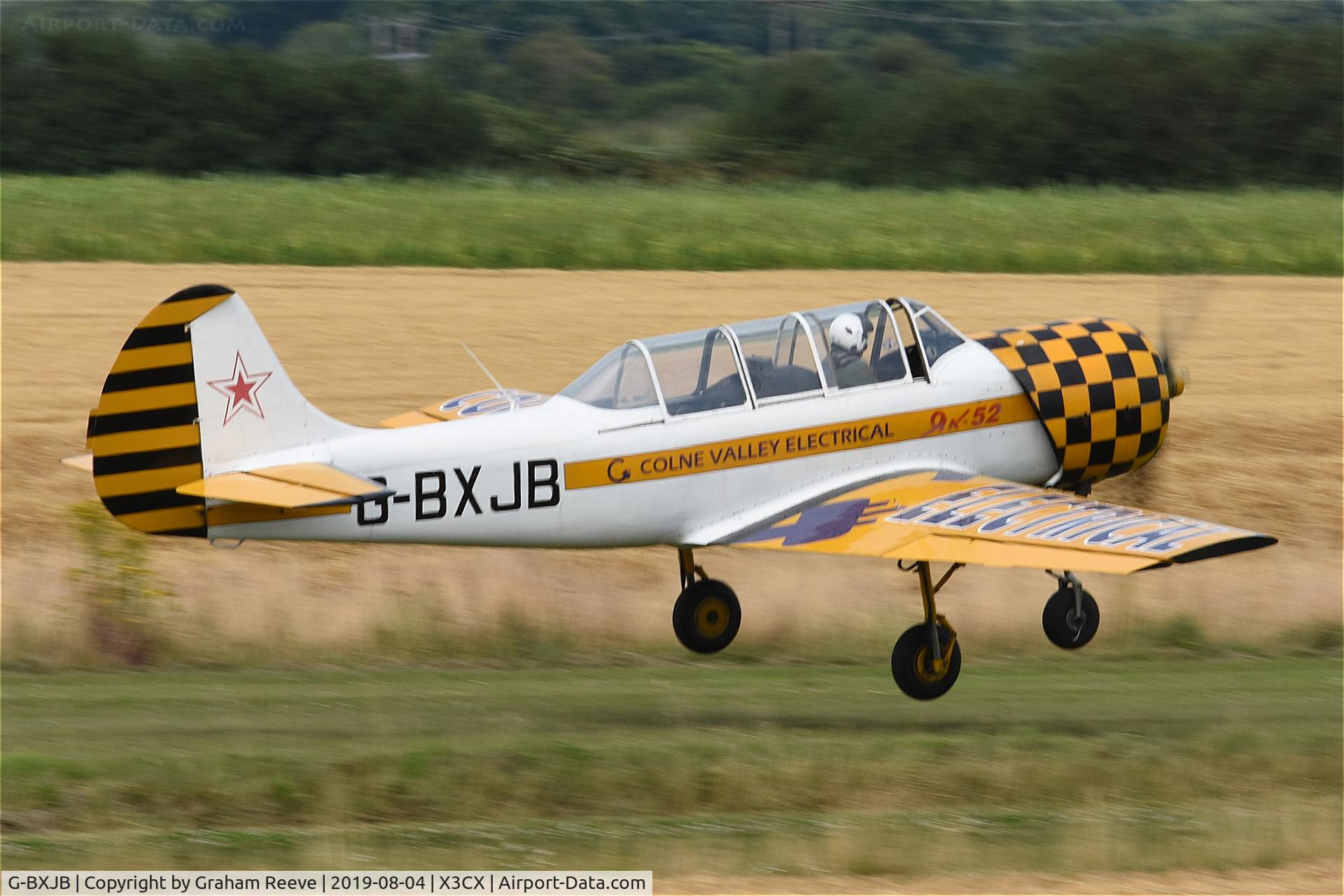 G-BXJB, 1987 Bacau Yak-52 C/N 877403, Departing from Northrepps.