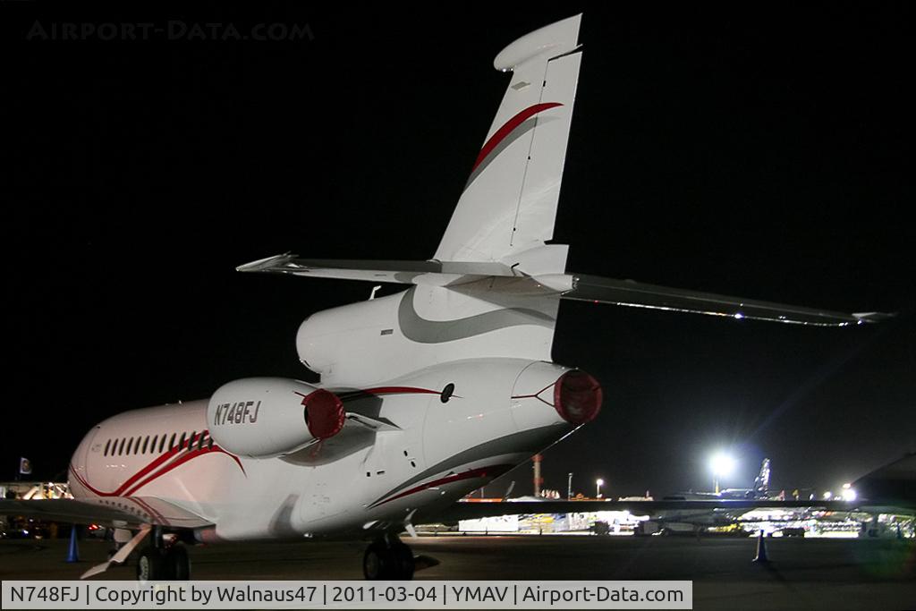 N748FJ, 2008 Dassault Falcon 7X C/N 48, Night-time close-cropped rear Port side view of Dassault Falcon 7X N748FJ Cn 48 on static display at the Avalon Airshow on 04Mar2011. This was a Dassault/Falcon Jet Demo aircraft. I also saw this aircraft at the Paris Air Show at Le Bourget on 24Jun2011.