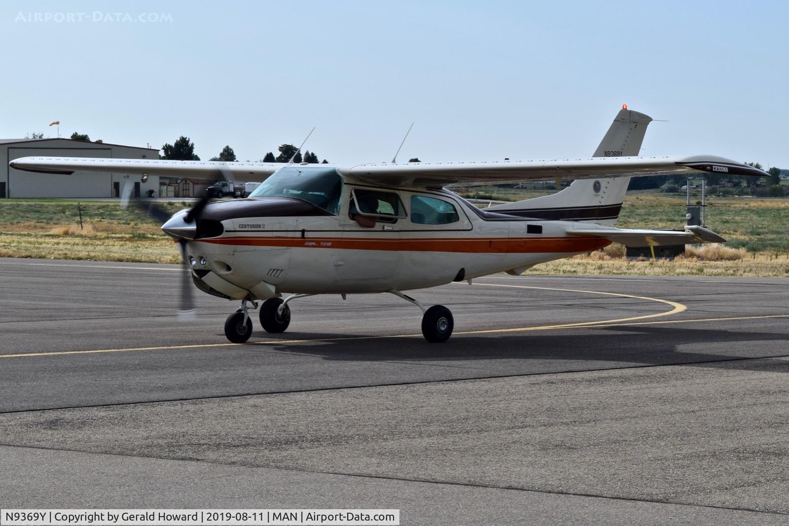 N9369Y, 1981 Cessna T210N Turbo Centurion C/N 21064488, Taxing on the GA ramp.