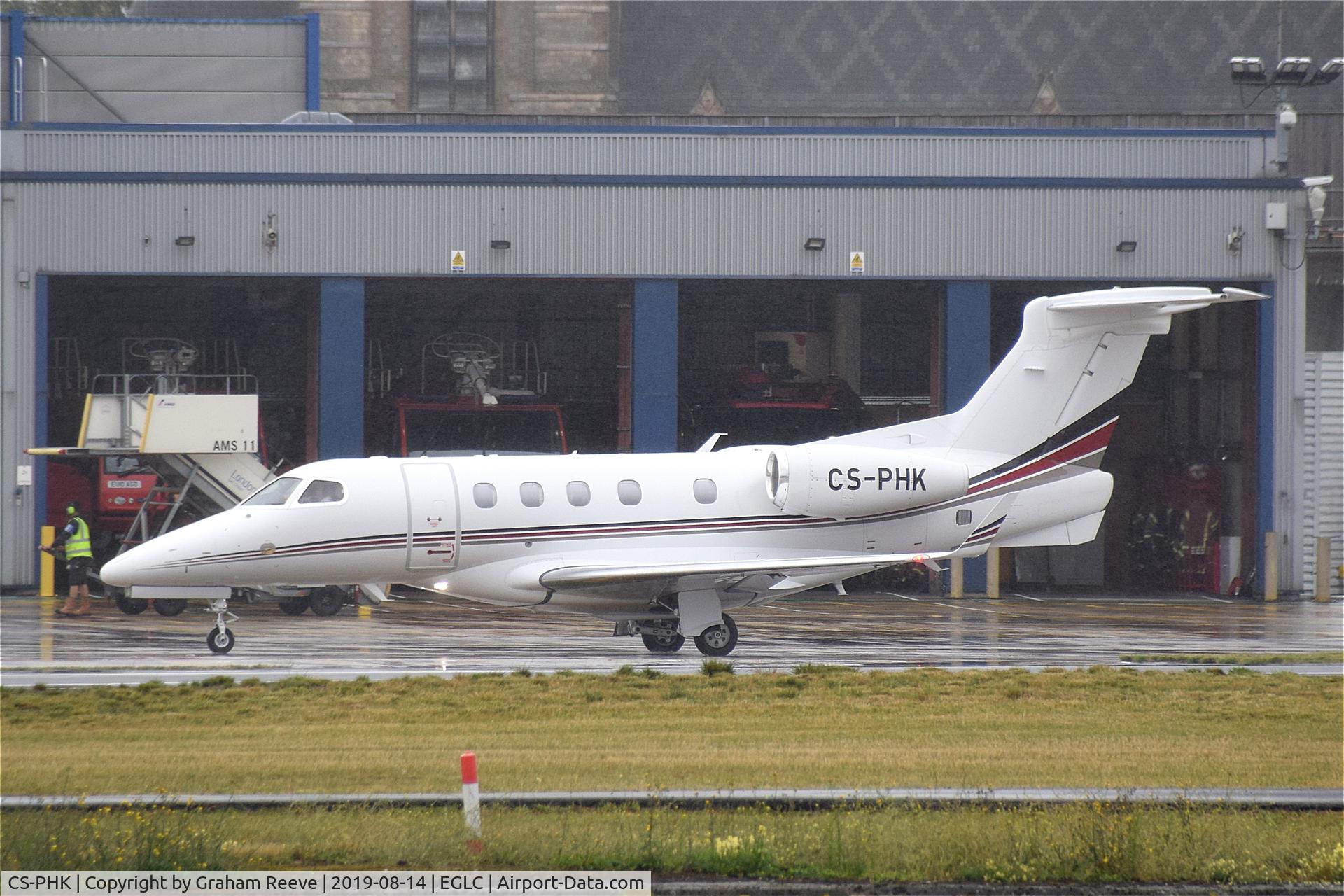 CS-PHK, 2017 Embraer EMB-505 Phenom 300 C/N 50500433, Departing a very wet London City.
