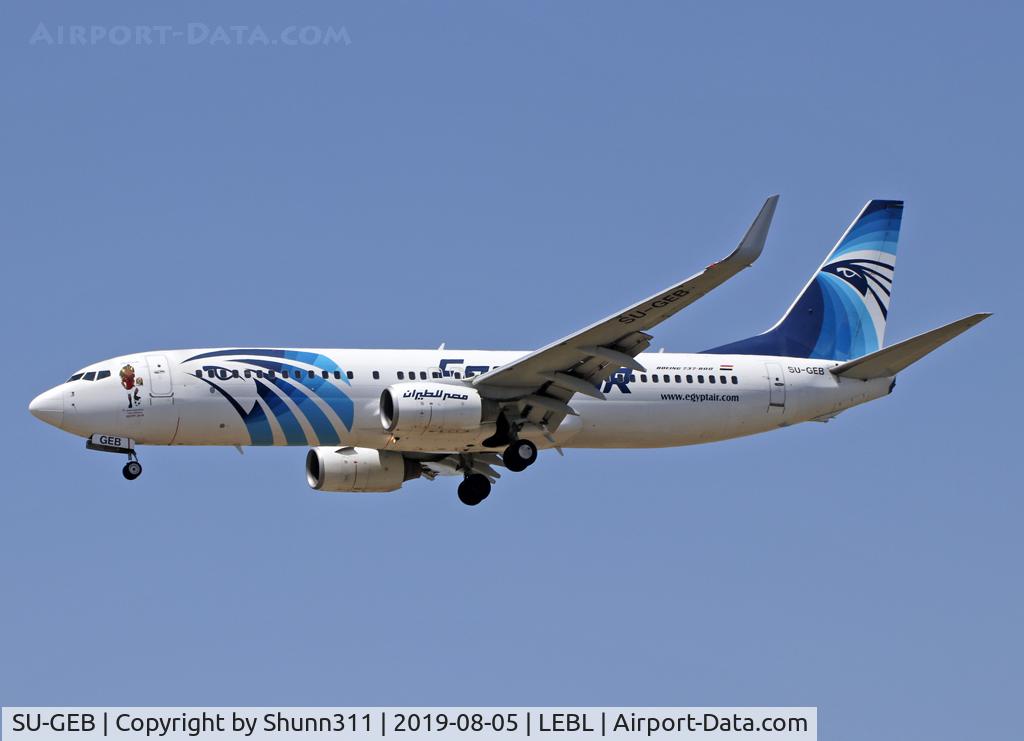 SU-GEB, 2011 Boeing 737-866 C/N 40800, Landing rwy 25R with additional patch near first door to promote Football Nations Cup during 2019