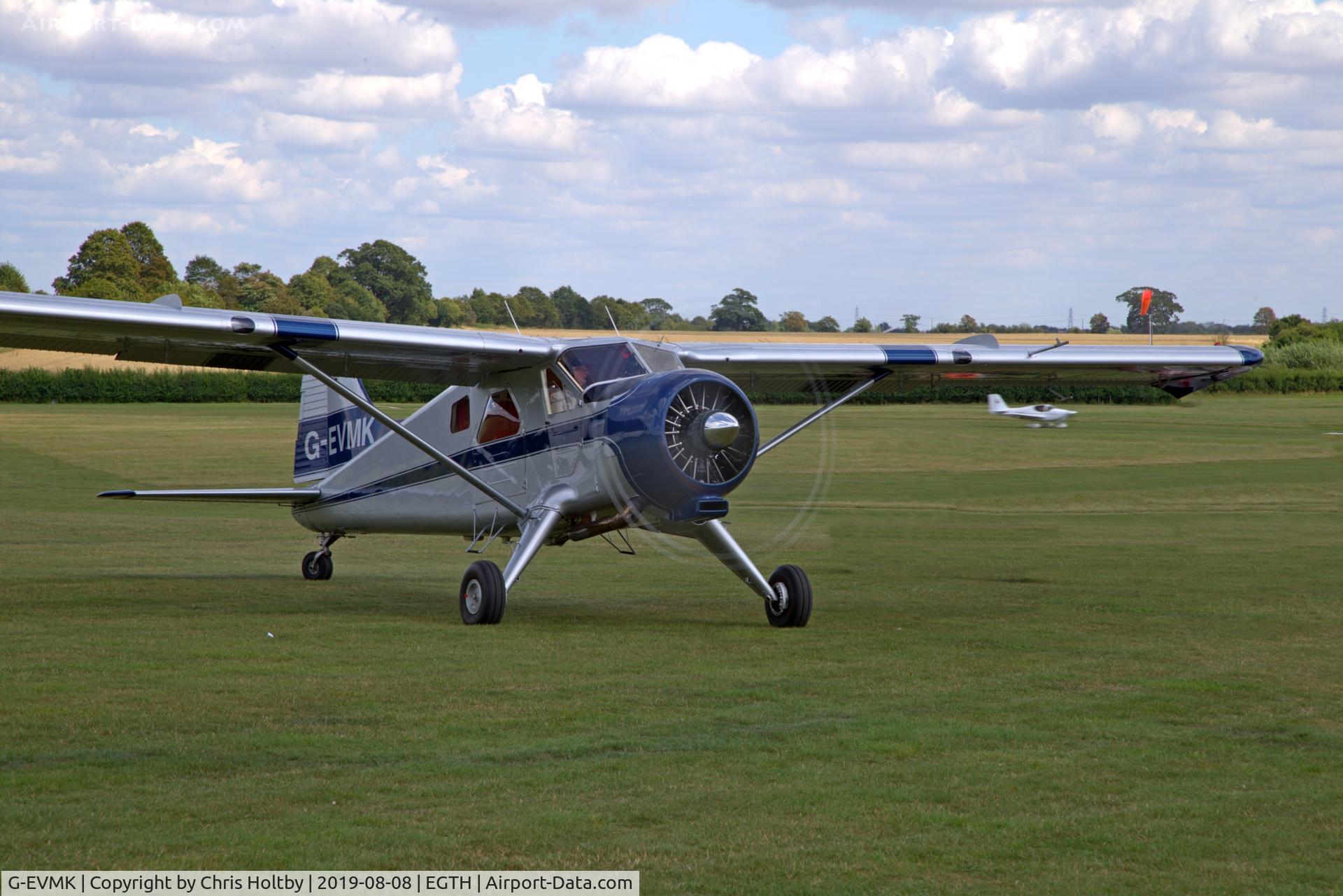 G-EVMK, 1953 De Havilland Canada U-6A Beaver C/N 672, 1953 Beaver taxiing to park at the Gathering of Moths 2019 at Old Warden