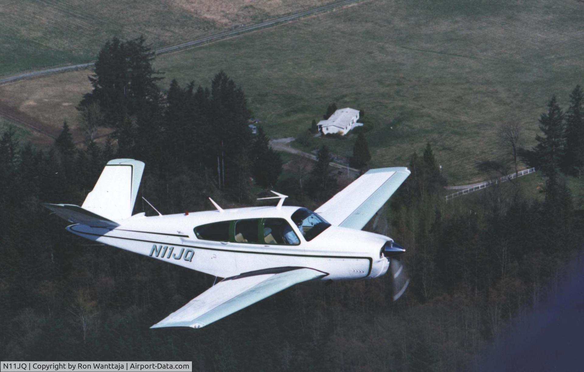N11JQ, 1965 Beech S35 Bonanza C/N D-7786, Circa 1995 over Kent WA