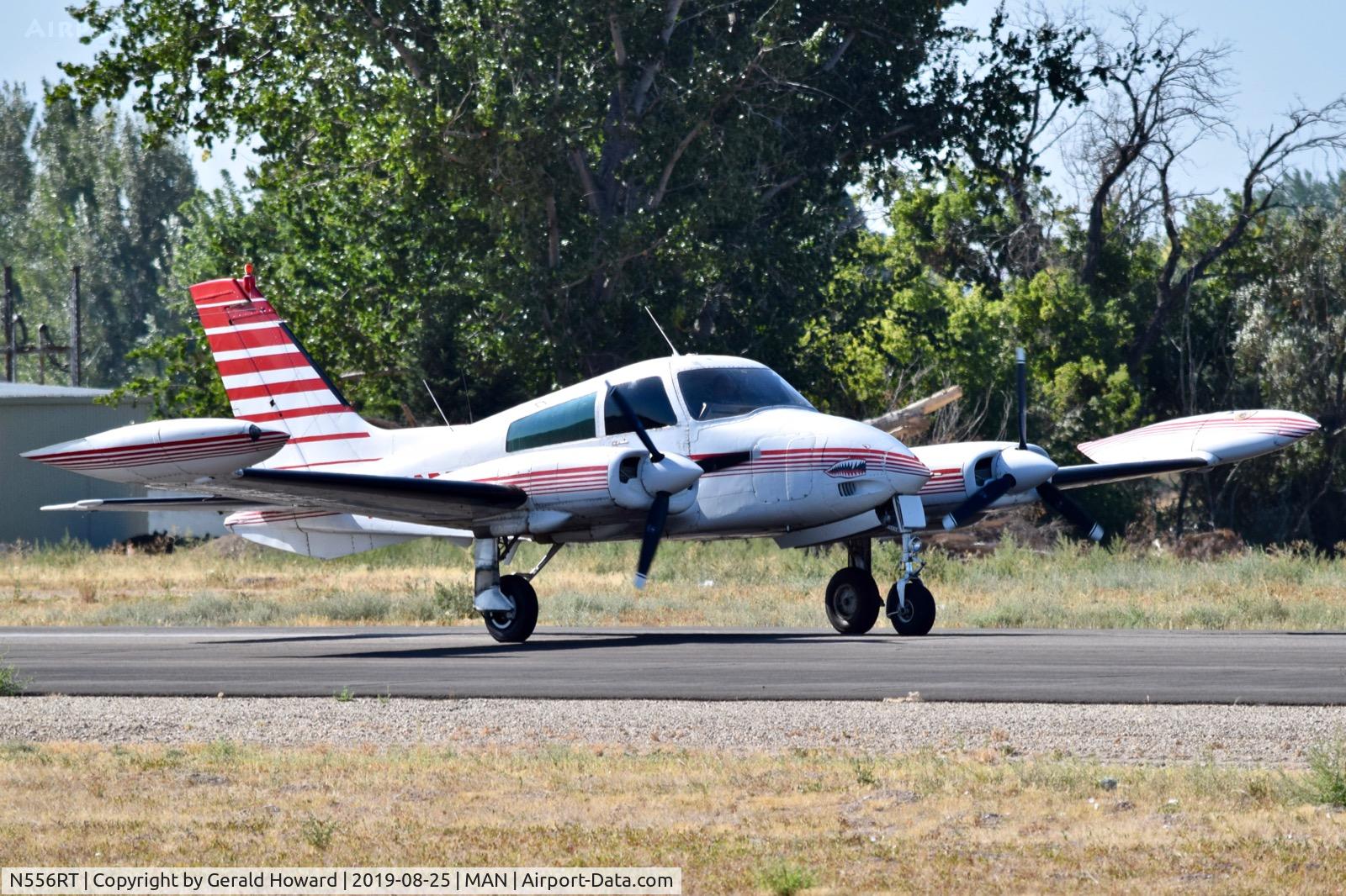 N556RT, 1969 Cessna 310P C/N 310P0077, Starting take off run on RWY 29.