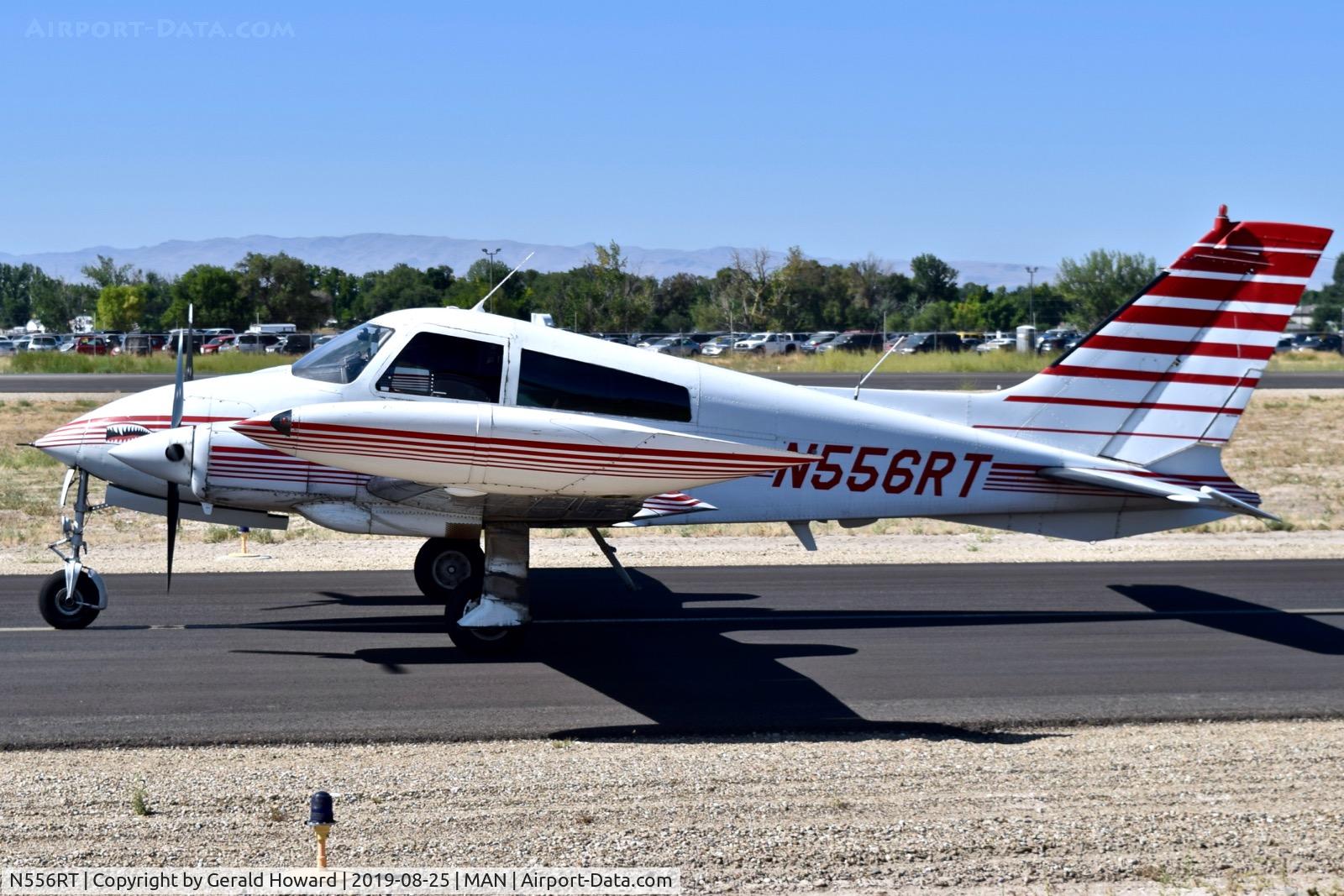 N556RT, 1969 Cessna 310P C/N 310P0077, Taxiing on Alpha.