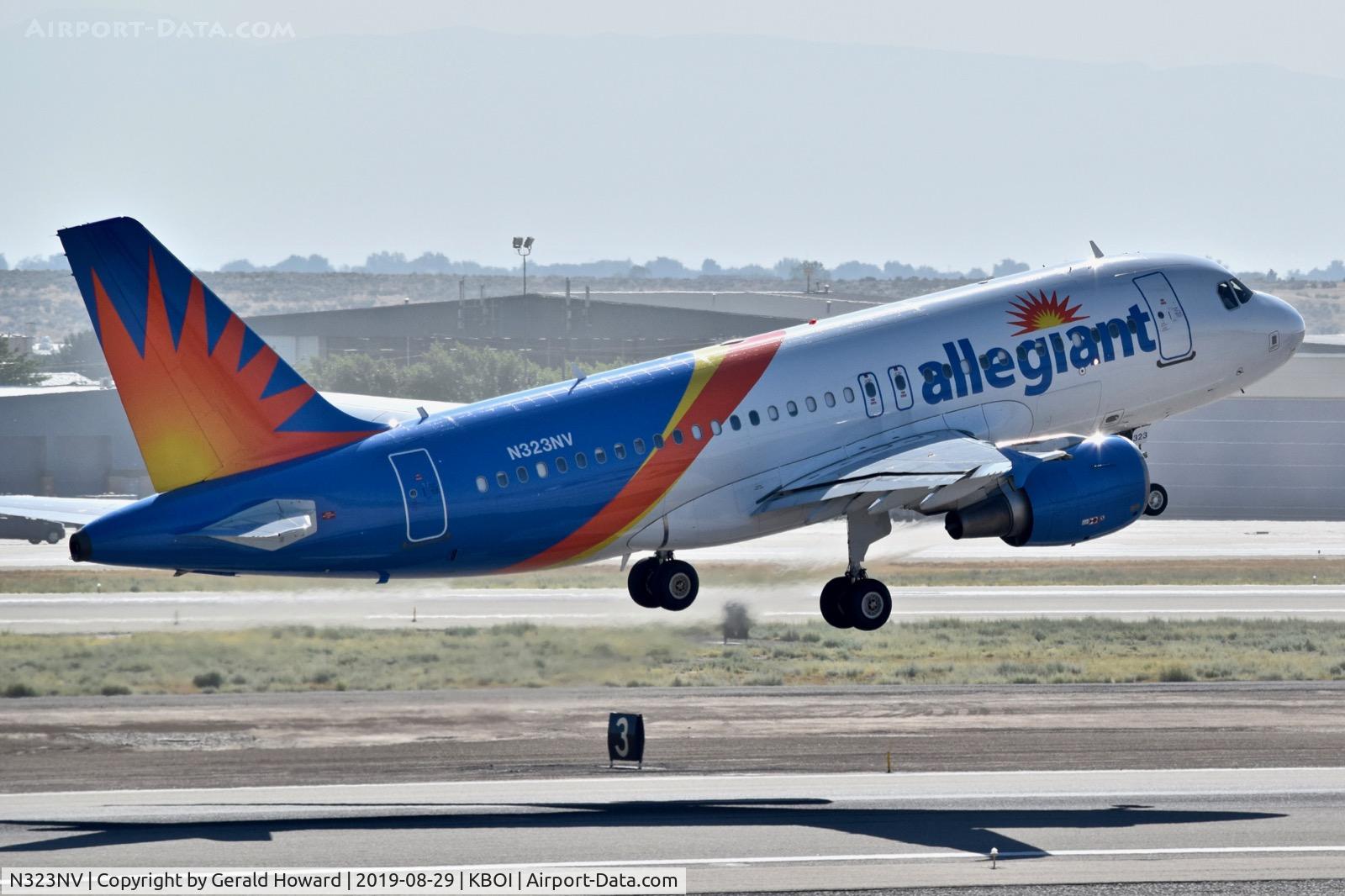 N323NV, 2005 Airbus A319-111 C/N 2538, Climb out from RWY 28R.