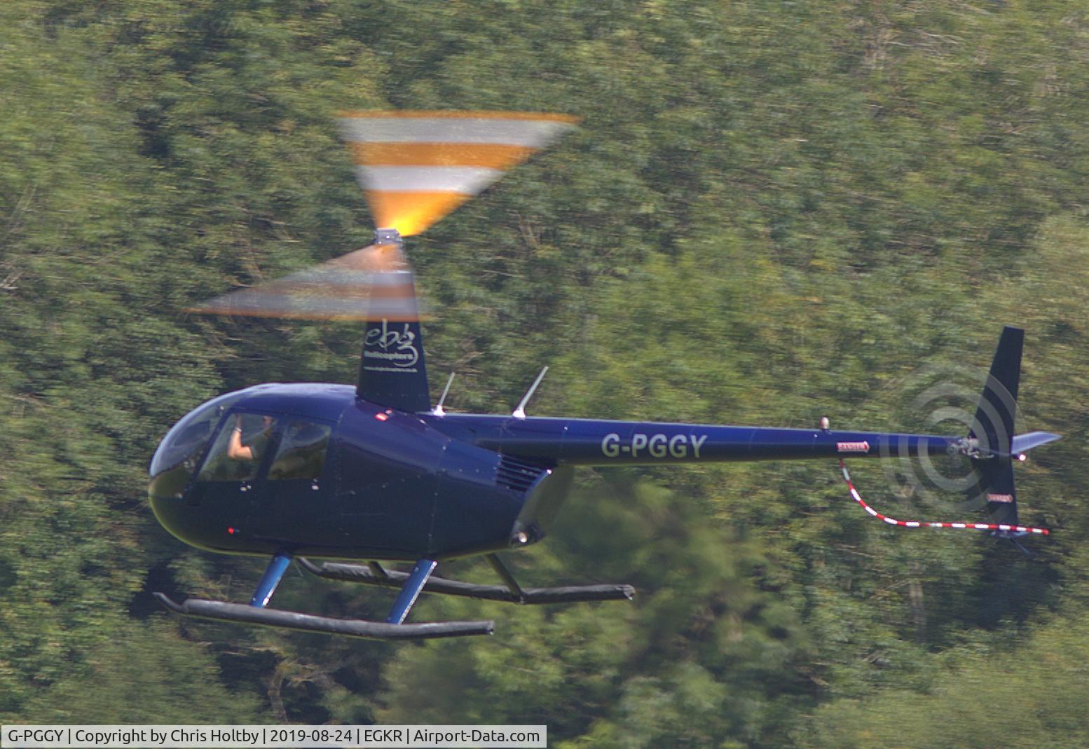 G-PGGY, 2006 Robinson R44 Clipper II C/N 11115, Robinson Clipper flying impressively round the aerodrome at Redhill