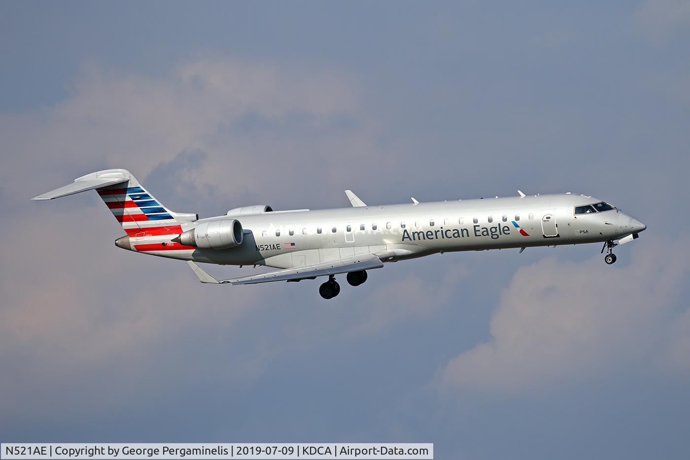 N521AE, 2004 Bombardier CRJ-701 (CL-600-2C10) Regional Jet C/N 10142, Turning final for runway 19