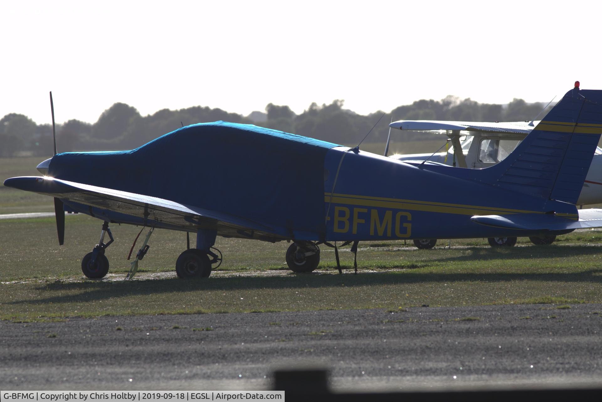 G-BFMG, 1977 Piper PA-28-161 Cherokee Warrior II C/N 28-7716160, Parked and covered at Andrewsfield