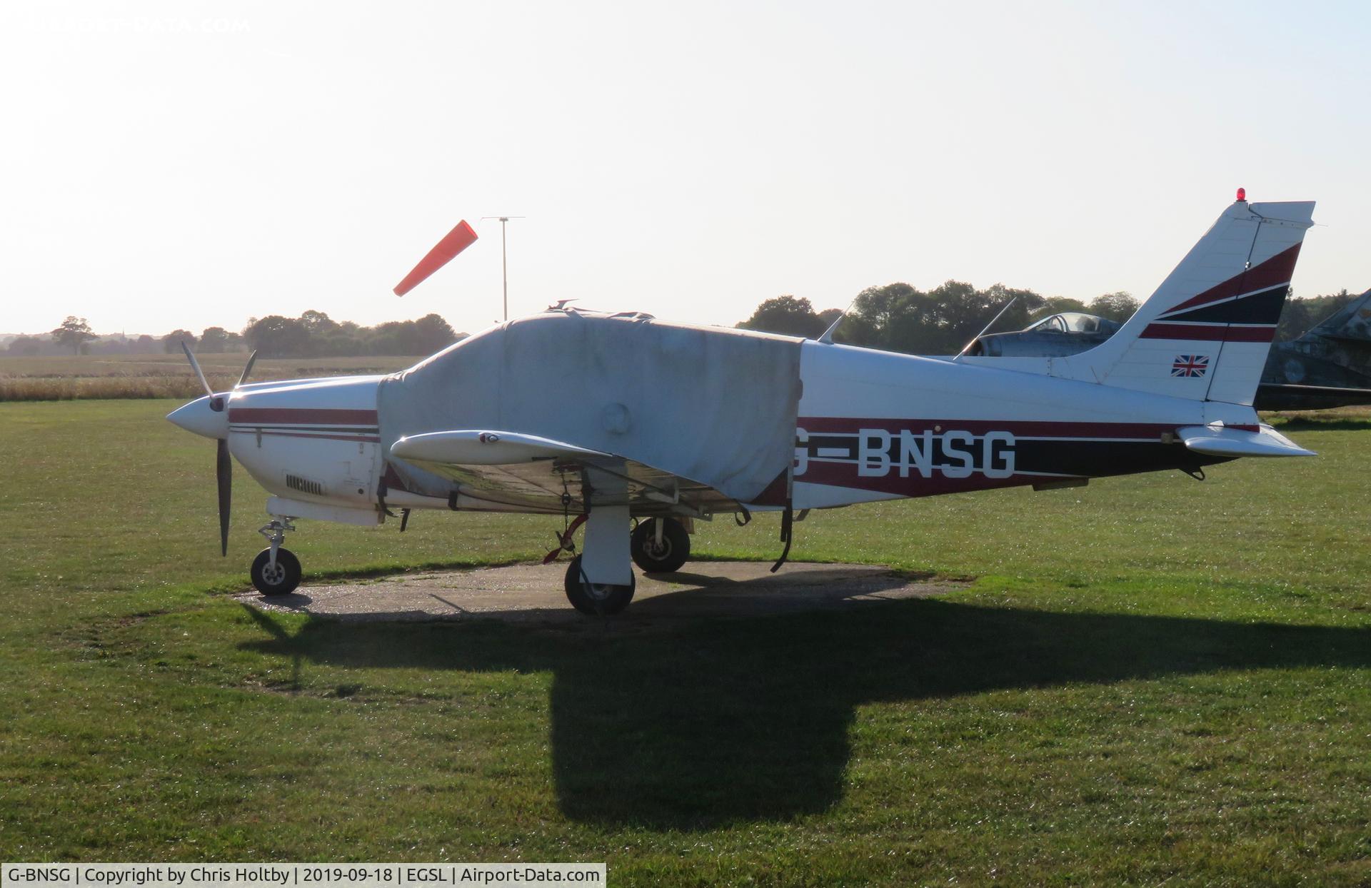 G-BNSG, 1978 Piper PA-28R-201 Cherokee Arrow III C/N 28R-7837205, Parked & covered at Andrewsfield