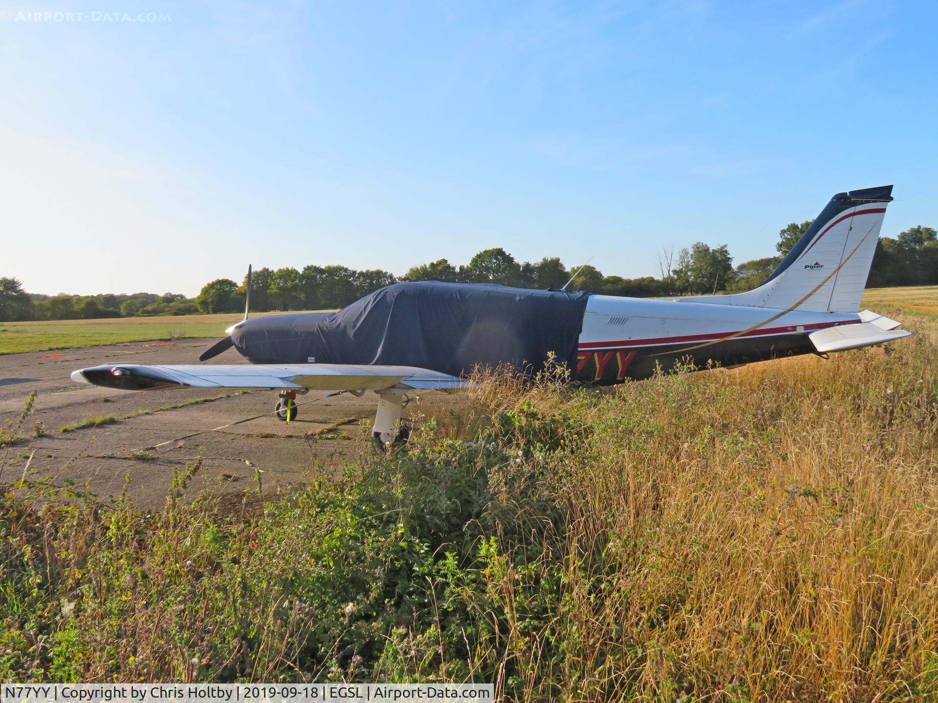 N77YY, 1999 Piper PA-32R-301T Turbo Saratoga C/N 3257120, Piper Saratoga parked & covered at Andrewsfield