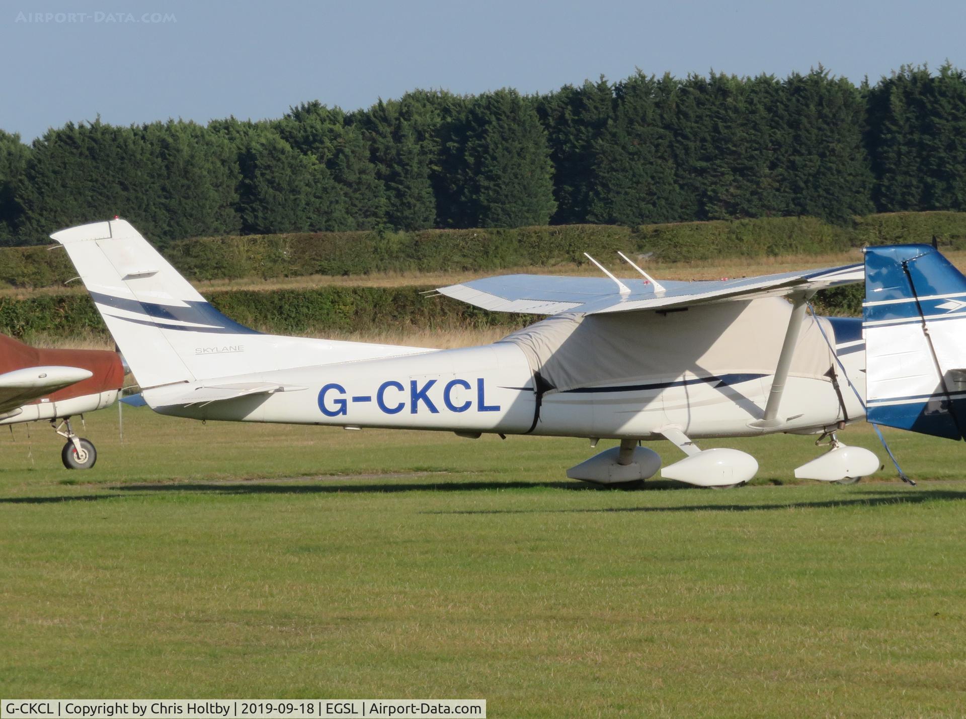 G-CKCL, 2005 Cessna 182T Skylane C/N 18281630, Parked and covered at Andrewsfield