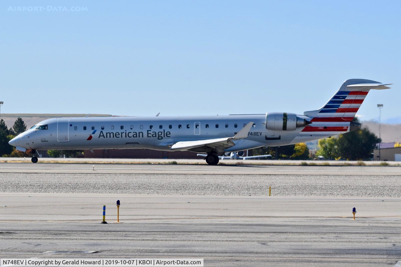 N748EV, 2004 Bombardier CRJ-700 (CL-600-2C10) Regional Jet C/N 10158, Landing roll out.