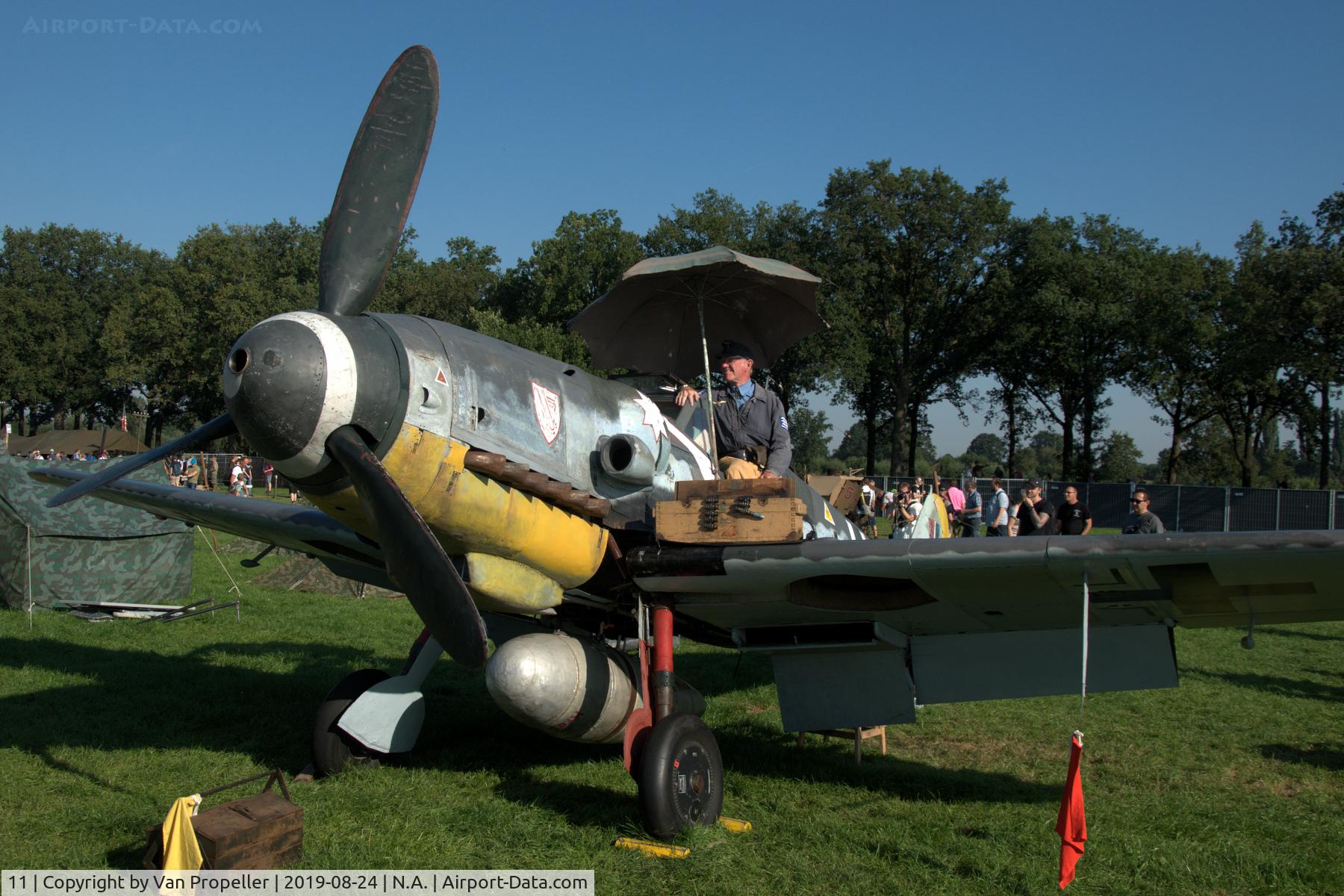 11, Messerschmitt Bf-109G-5 C/N 15343, Restored Messerschmitt Bf 109G-5 at a temporary airfield in a meadow near Ede, the Netherlands. Wings of Freedom air show, 2019. Re-enactor on the wing