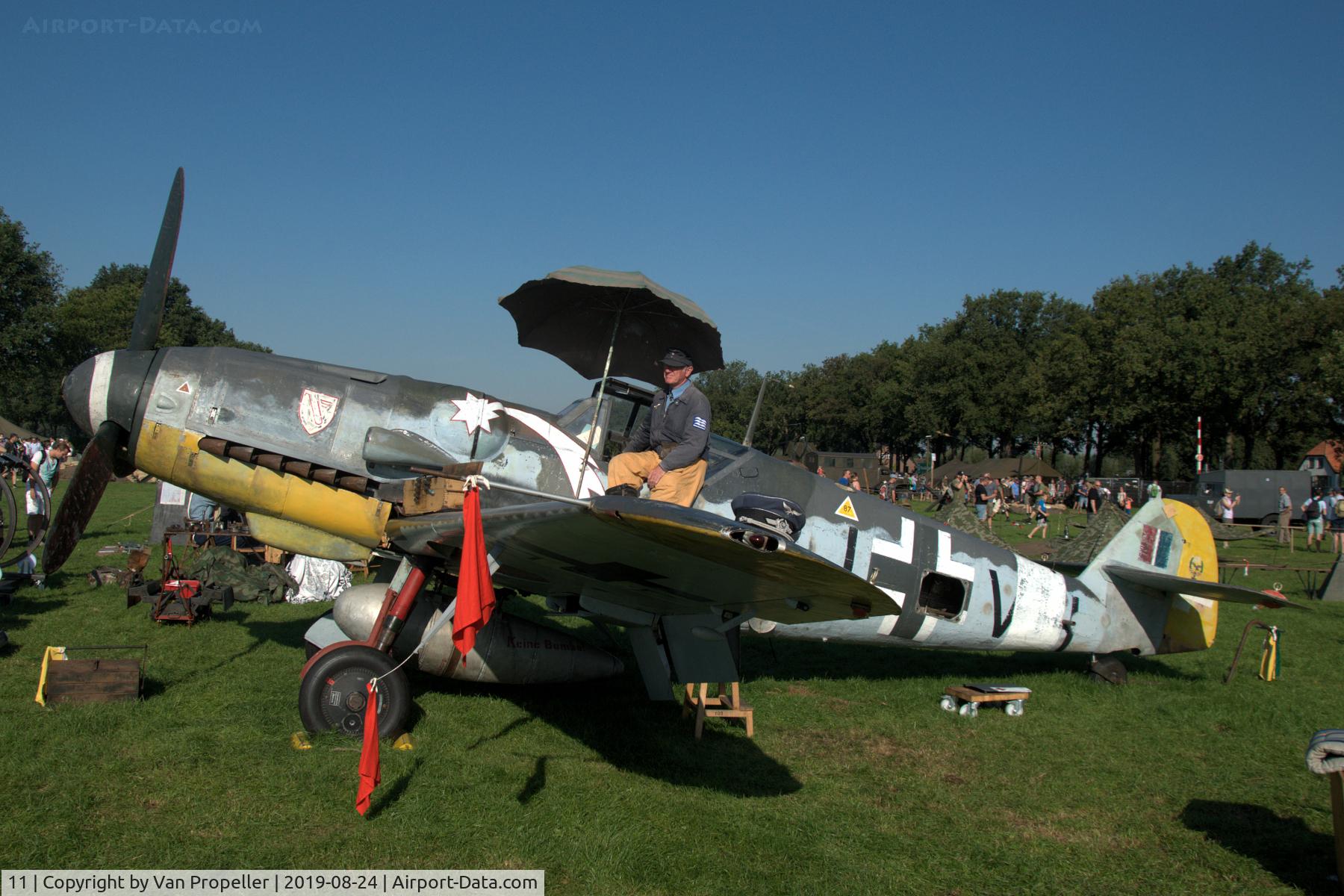 11, Messerschmitt Bf-109G-5 C/N 15343, Restored Messerschmitt Bf 109G-5 at a temporary airfield in a meadow near Ede, the Netherlands. Wings of Freedom air show, 2019. Re-enactor on the wing