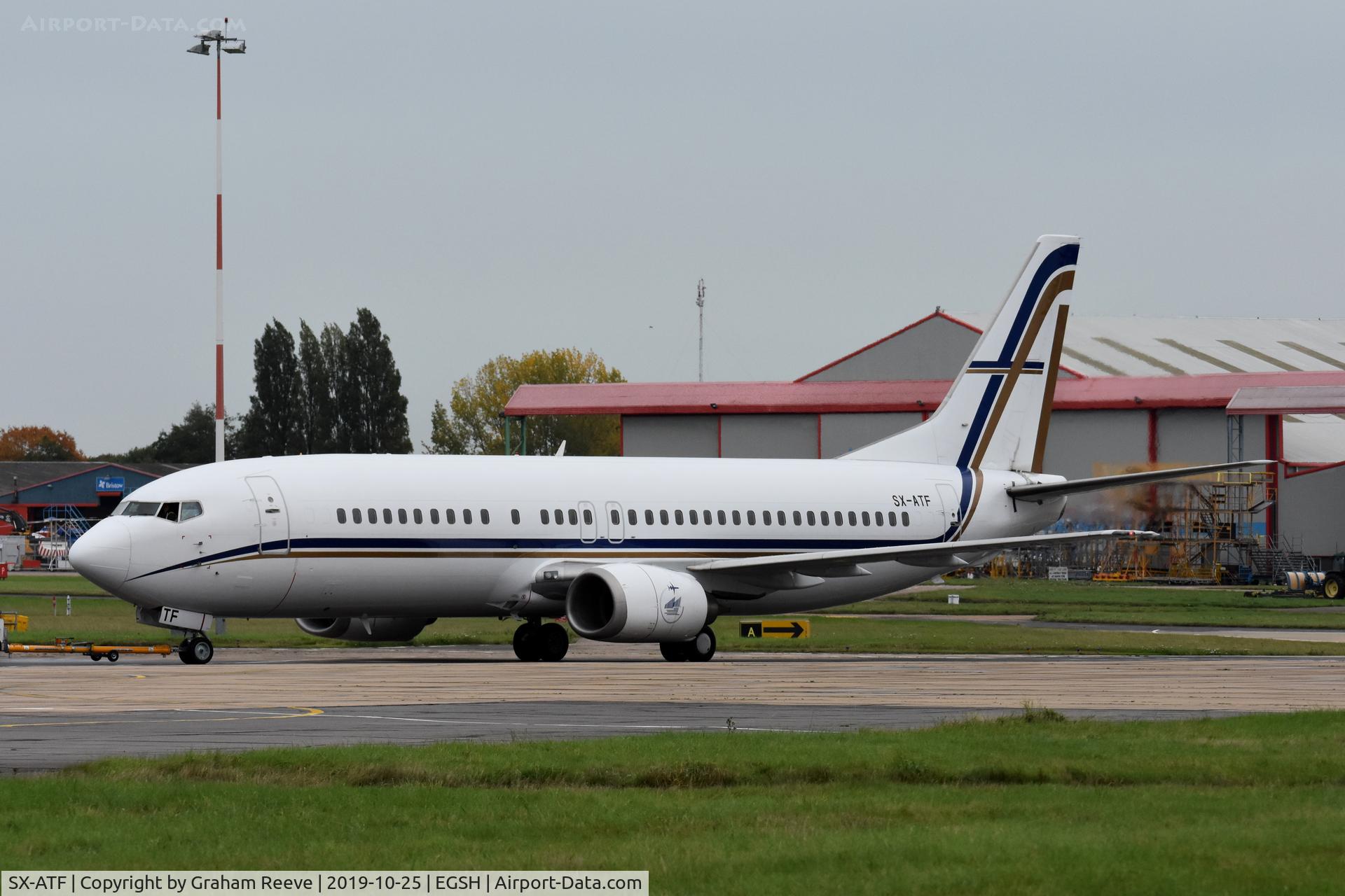 SX-ATF, 1992 Boeing 737-406 C/N 25423, Under tow at Norwich.
