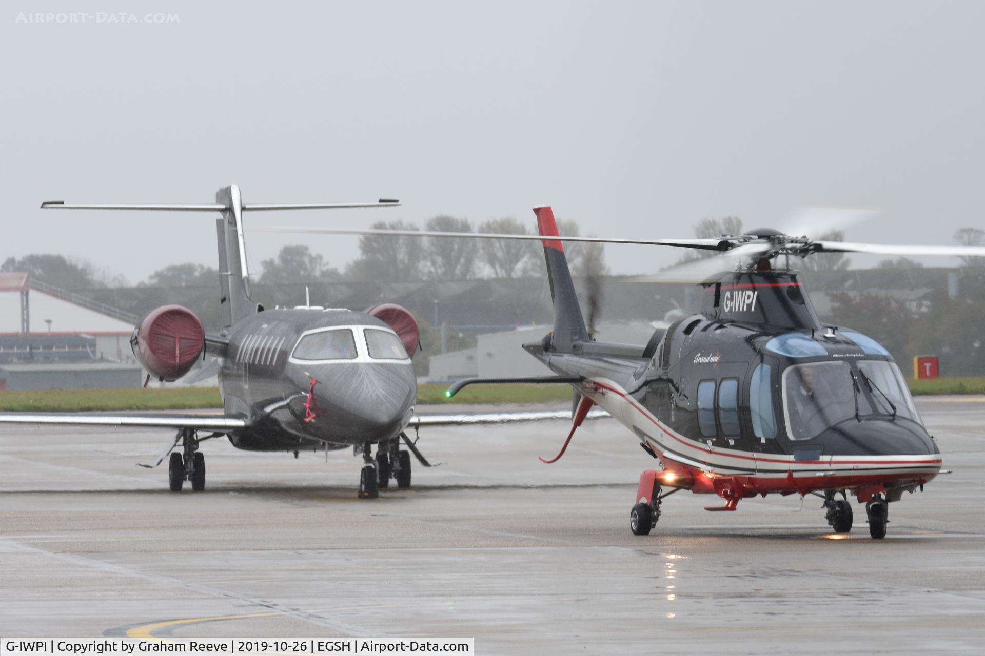 G-IWPI, 2013 AgustaWestland AW-109SP GrandNew C/N 22299, Parked in front of M-RBIG.