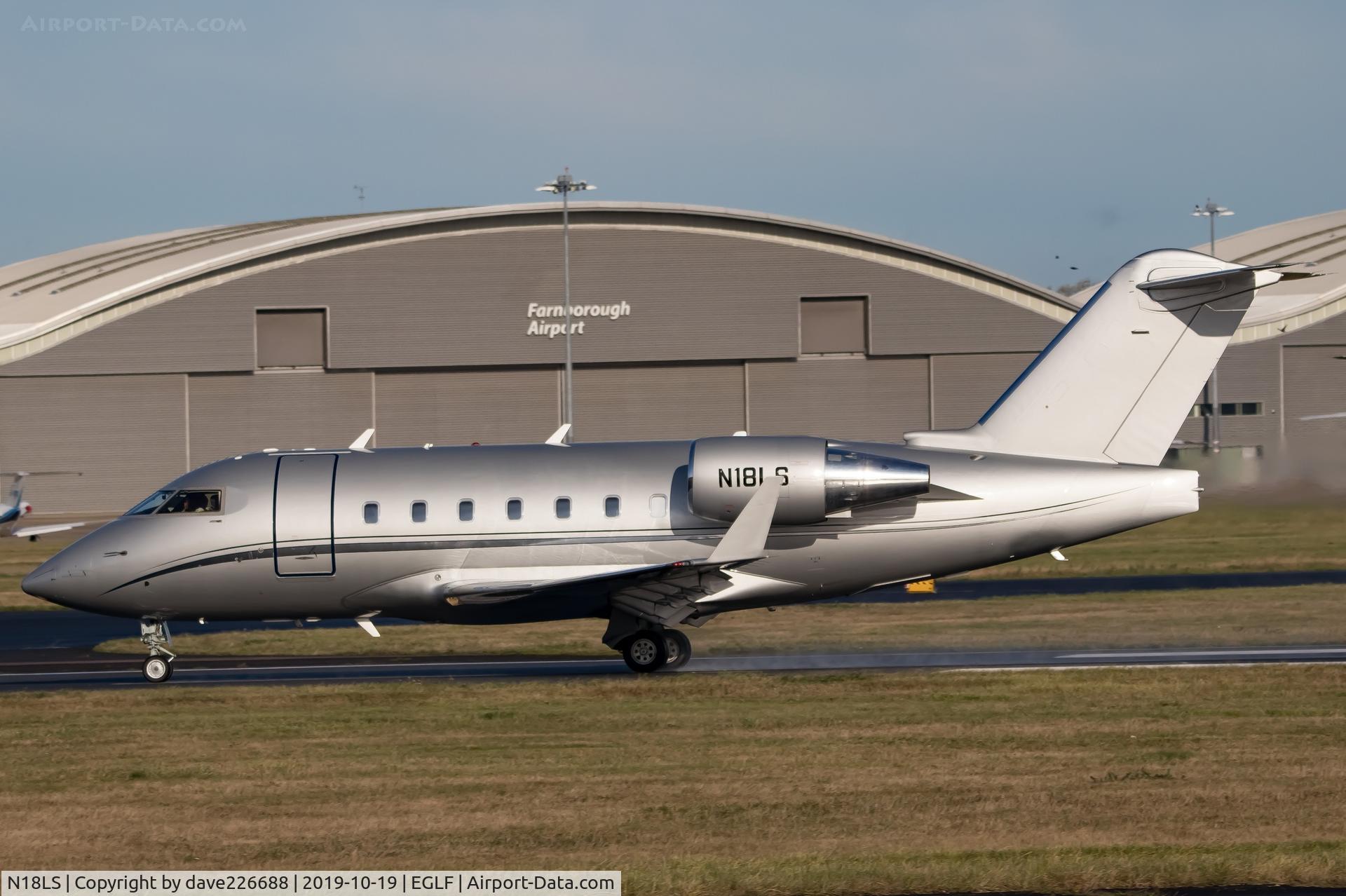 N18LS, 2006 Bombardier Challenger 604 (CL-600-2B16) C/N 5658, N18LS taking off from Farnborough and blending in with the now Ex TAG Hangers in the bakground