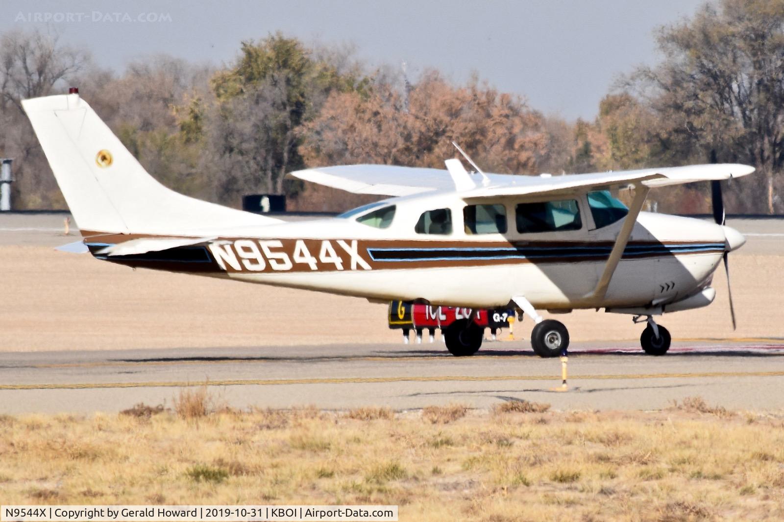 N9544X, 1961 Cessna 210B C/N 21057844, Between the runways.
