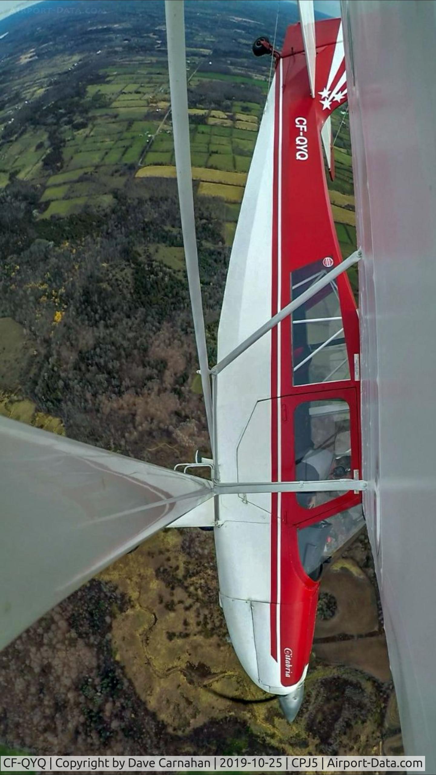 CF-QYQ, 1965 Champion 7ECAX Citabria C/N 128X, CF-QYQ during a brief steep descent north of Stirling, Ontario, Canada. Photo is a still taken from GoPro video clip with camera mounted on outer wing strut.