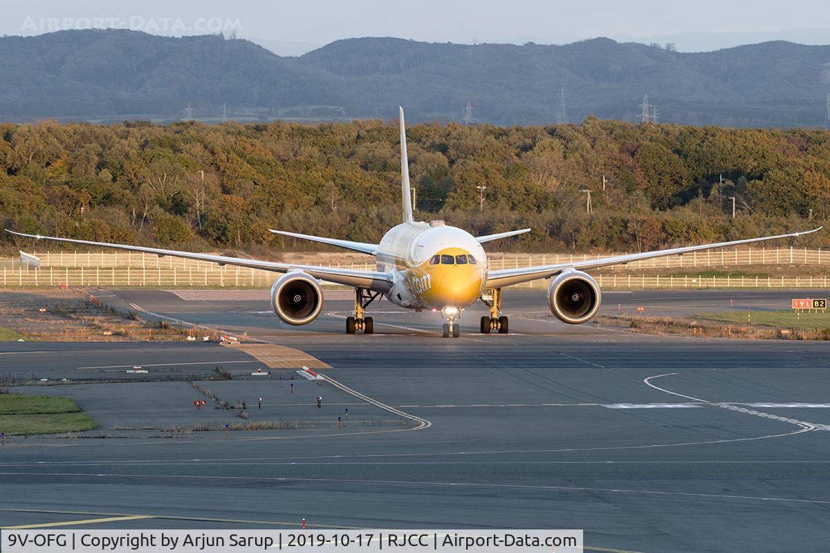 9V-OFG, 2016 Boeing 787-9 Dreamliner C/N 37123, “Kama Scootra”  about to cross from Rwy 01R to 01L at Sapporo after arriving in the autumn evening as TR892 from Taipei.