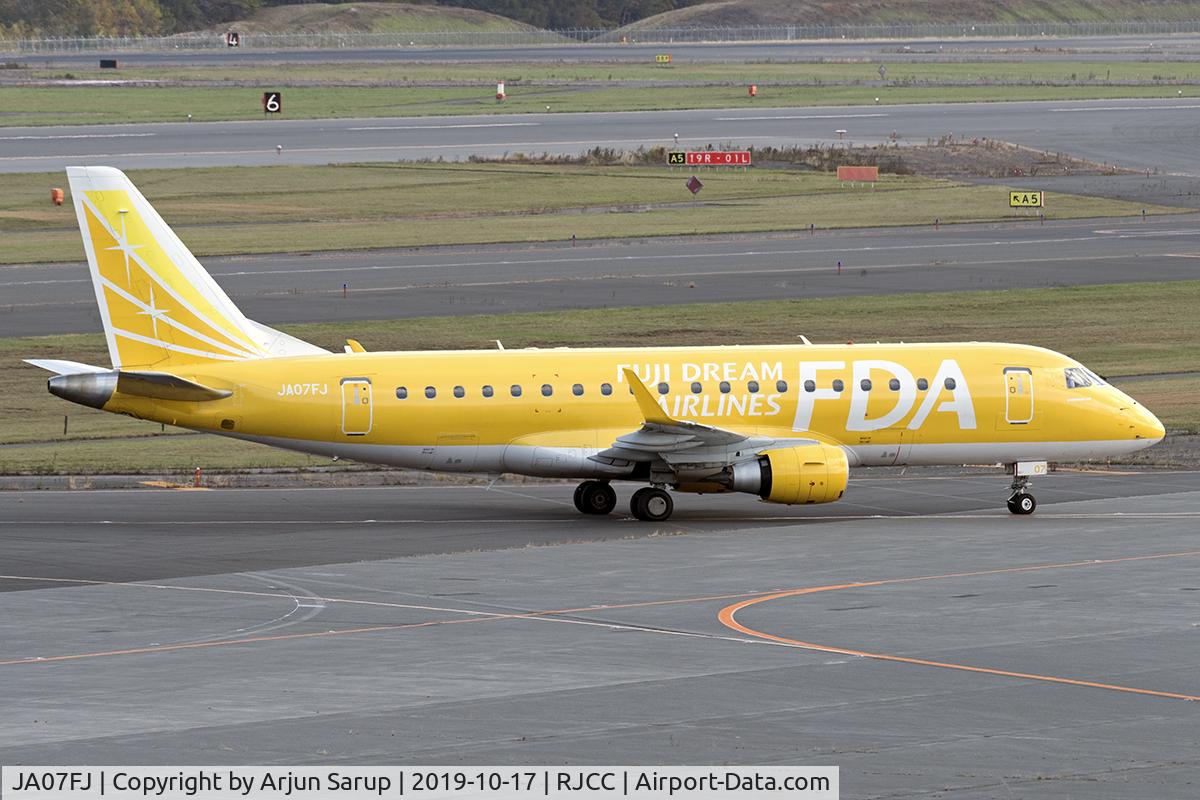 JA07FJ, 2013 Embraer ERJ-175ST C/N 17000361, Taxiing by the terminal at Sapporo.