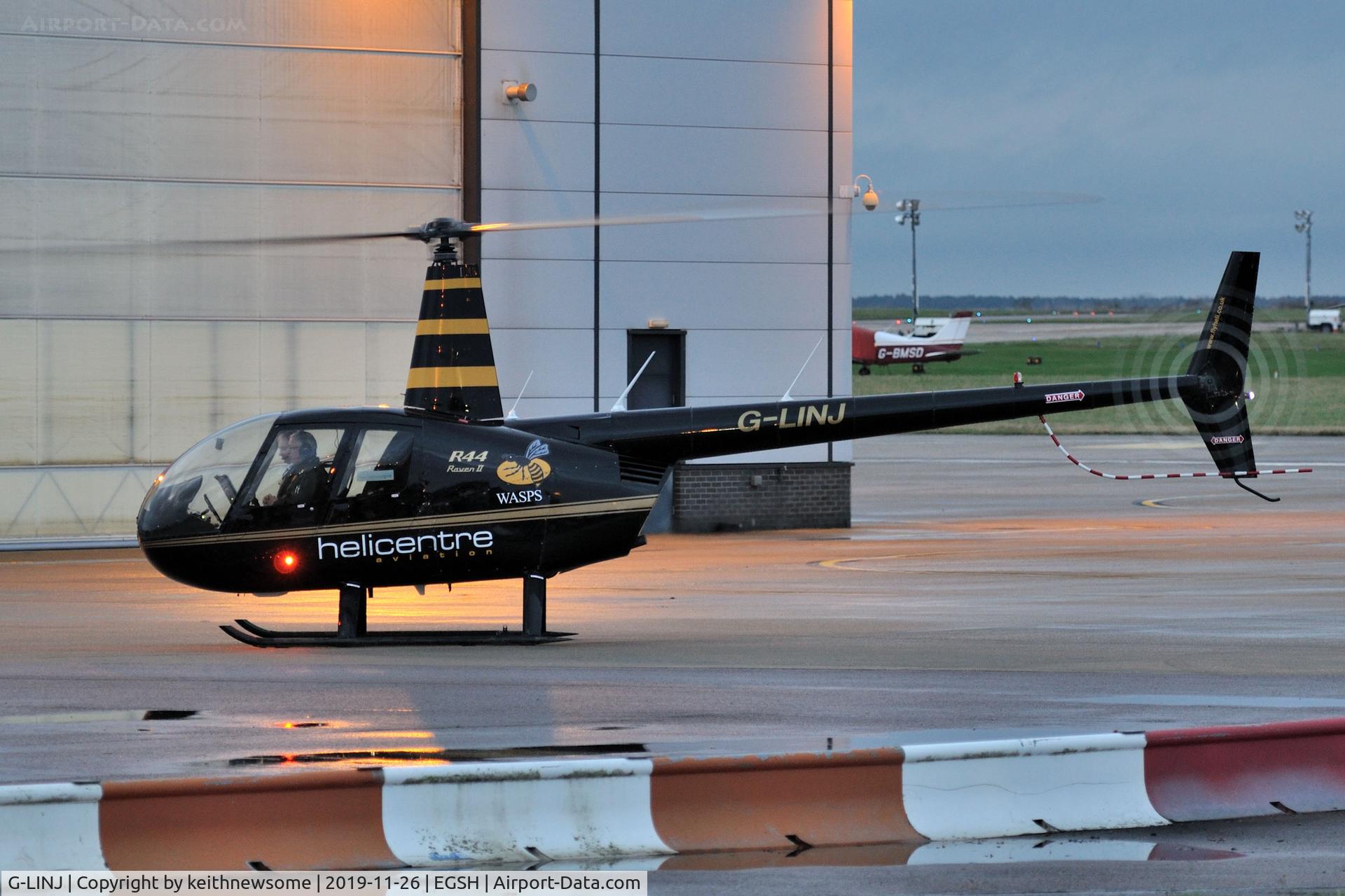 G-LINJ, 2008 Robinson R44 Raven II C/N 12168, With 'wasp' logos.