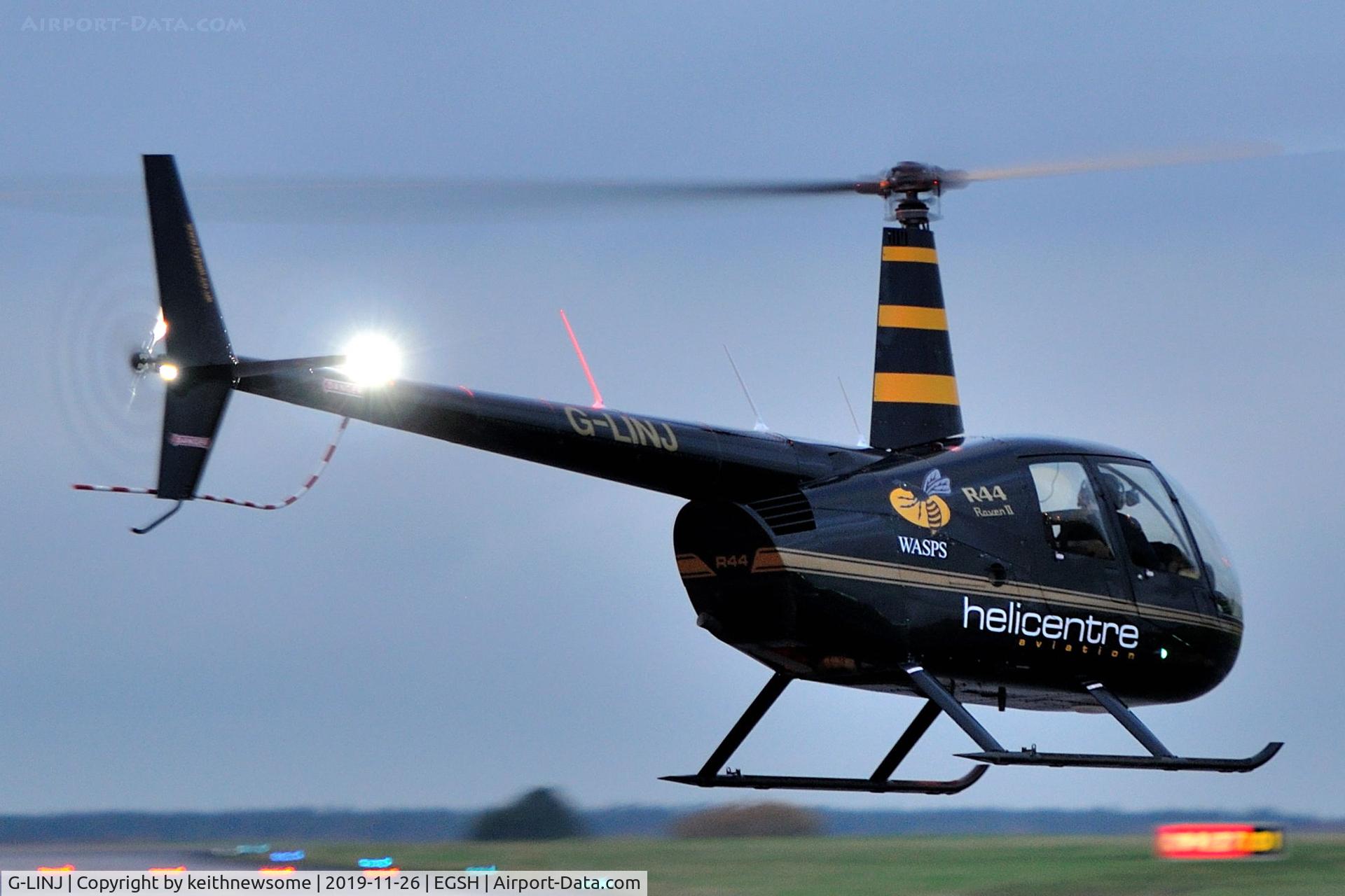 G-LINJ, 2008 Robinson R44 Raven II C/N 12168, With 'wasp' logos.